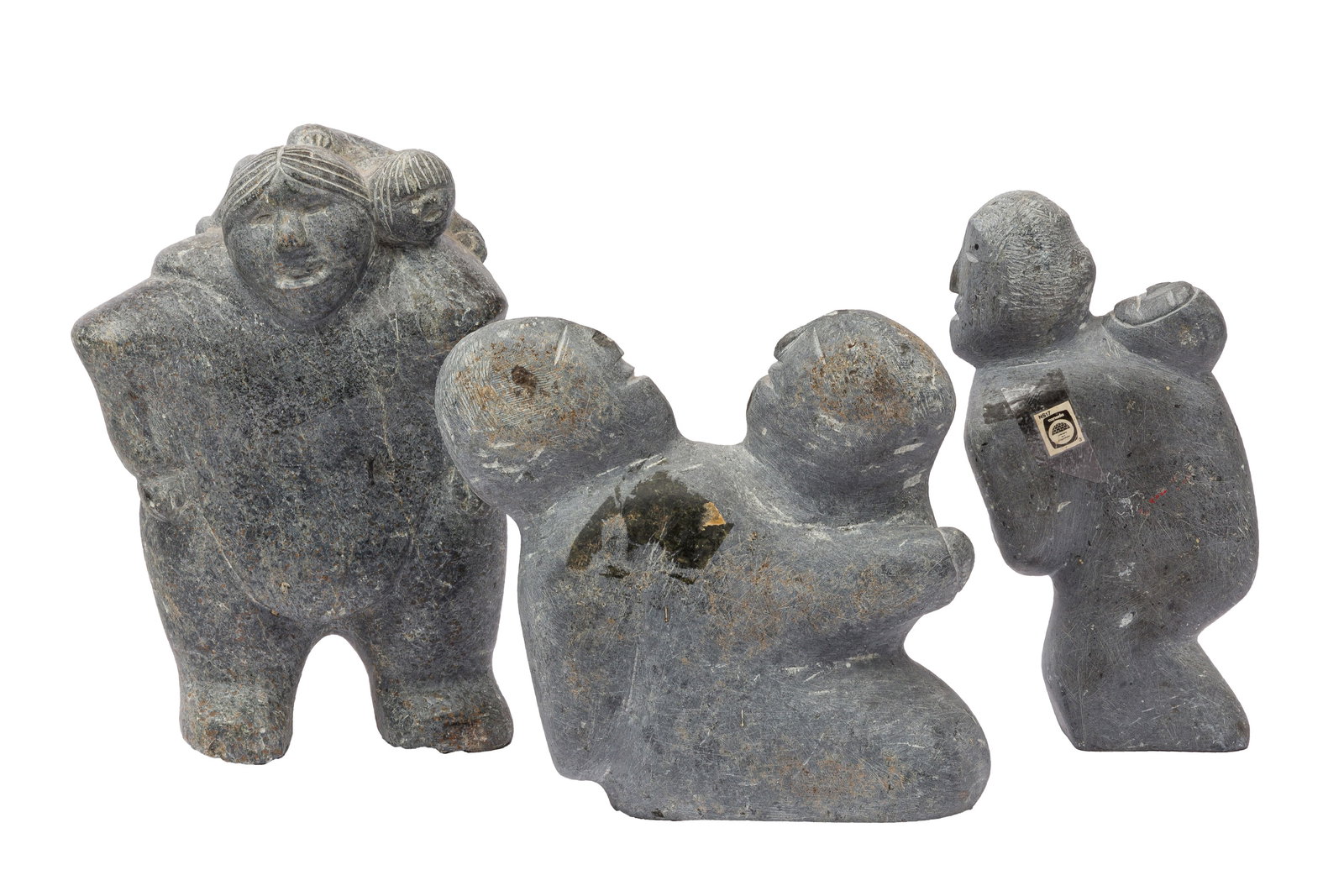 A GROUP OF THREE CARVED STONE INUIT SCULPTURES (1 of 1)