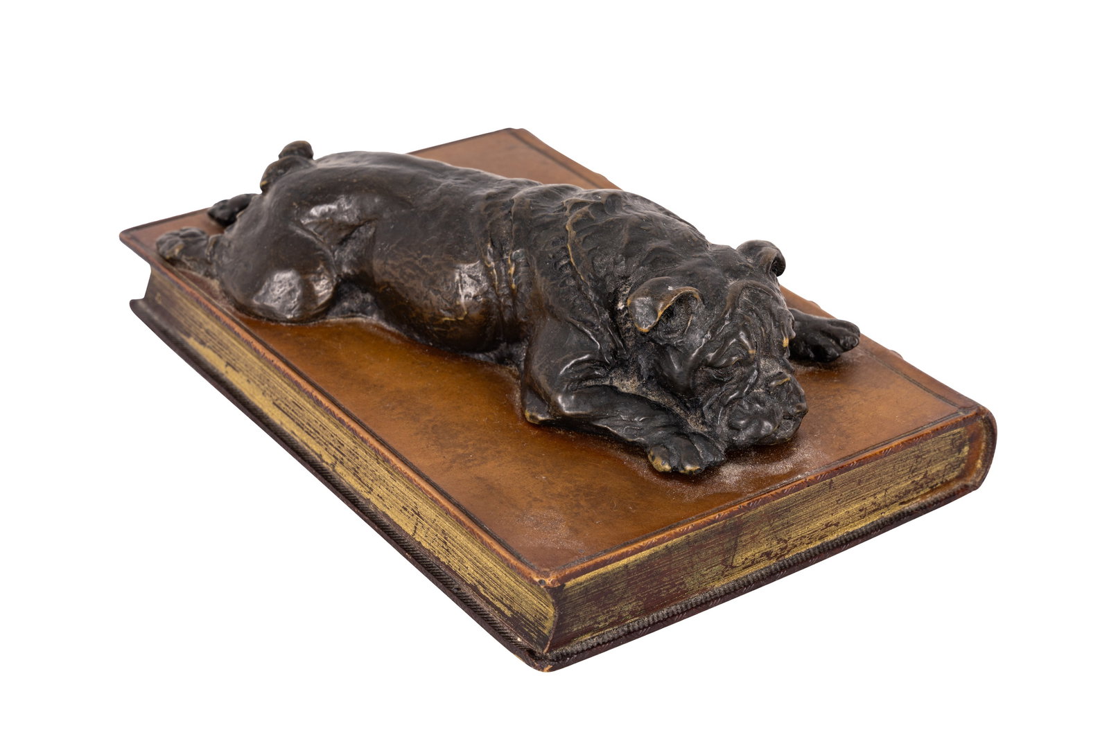 AFTER DORIS LINDNER, BRONZED RESIN STUDY OF A RECUMBANT BULLDOG: AFTER DORIS LINDNER, BRONZED RESIN STUDY OF A RECUMBANT BULLDOG, signed 'Lindner' to body, over resin copy of a gilt tooled morocco copy of 'ALFRED THE GREAT' Dimensions: 6cm high, 18cm wide, 13cm dee