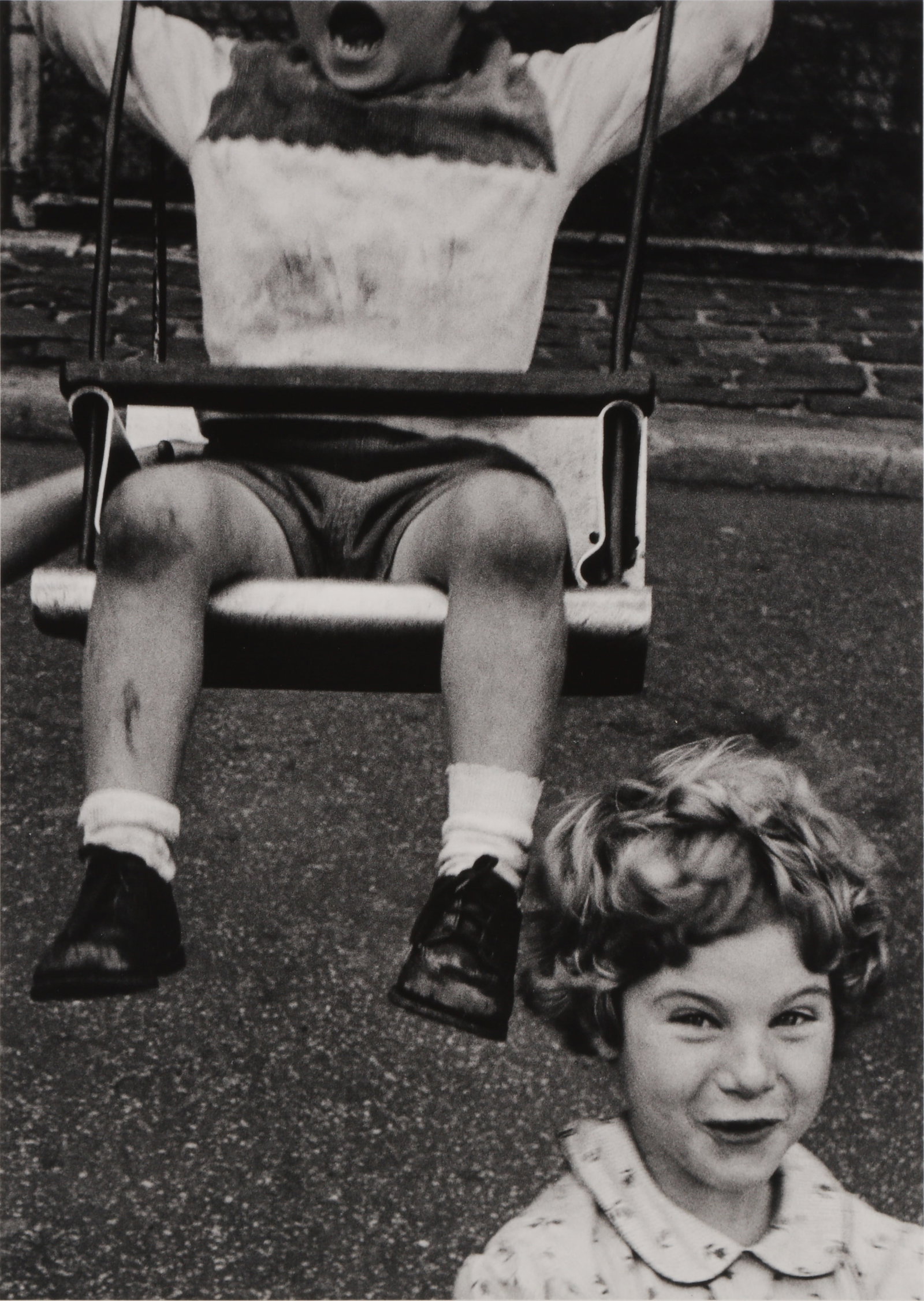 § William Klein (1926-2022): William Klein (1926-2022) BOY + SWING + SIMPERING GIRL, NEW YORK, 1955. Silver gelatin print, printed later, image size 28 x 20cm, sheet size 30.5 x 23.6cm, signed, titled and dated in pencil by the p