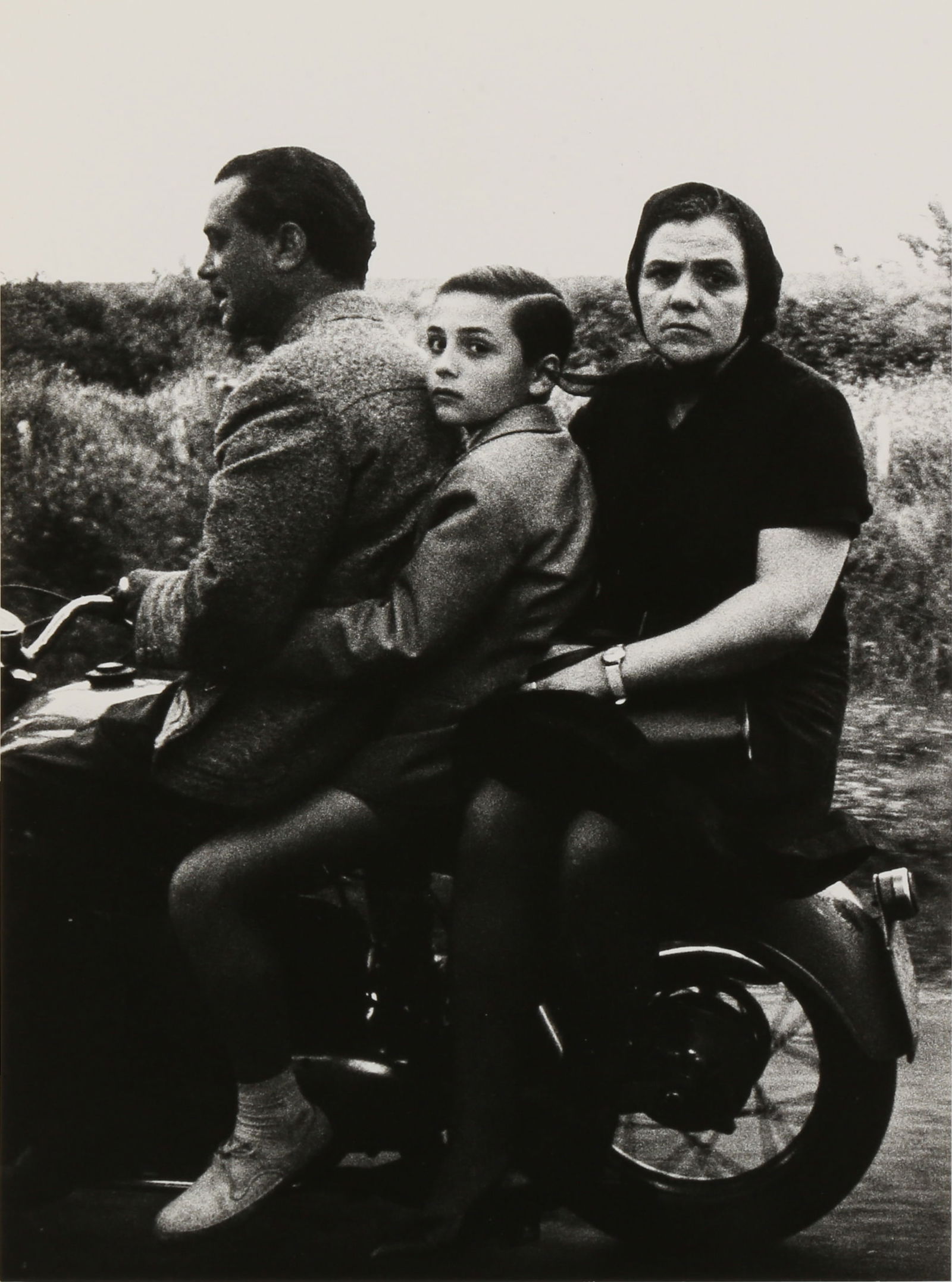 § William Klein (1926-2022): William Klein (1926-2022) HOLY FAMILY ON VESPA, ROME, 1956. Silver gelatin print, printed 1980s, image size 23 x 17cm, sheet size 23.6 x 17.6cm, titled and dated by the photographer in pencil verso, w