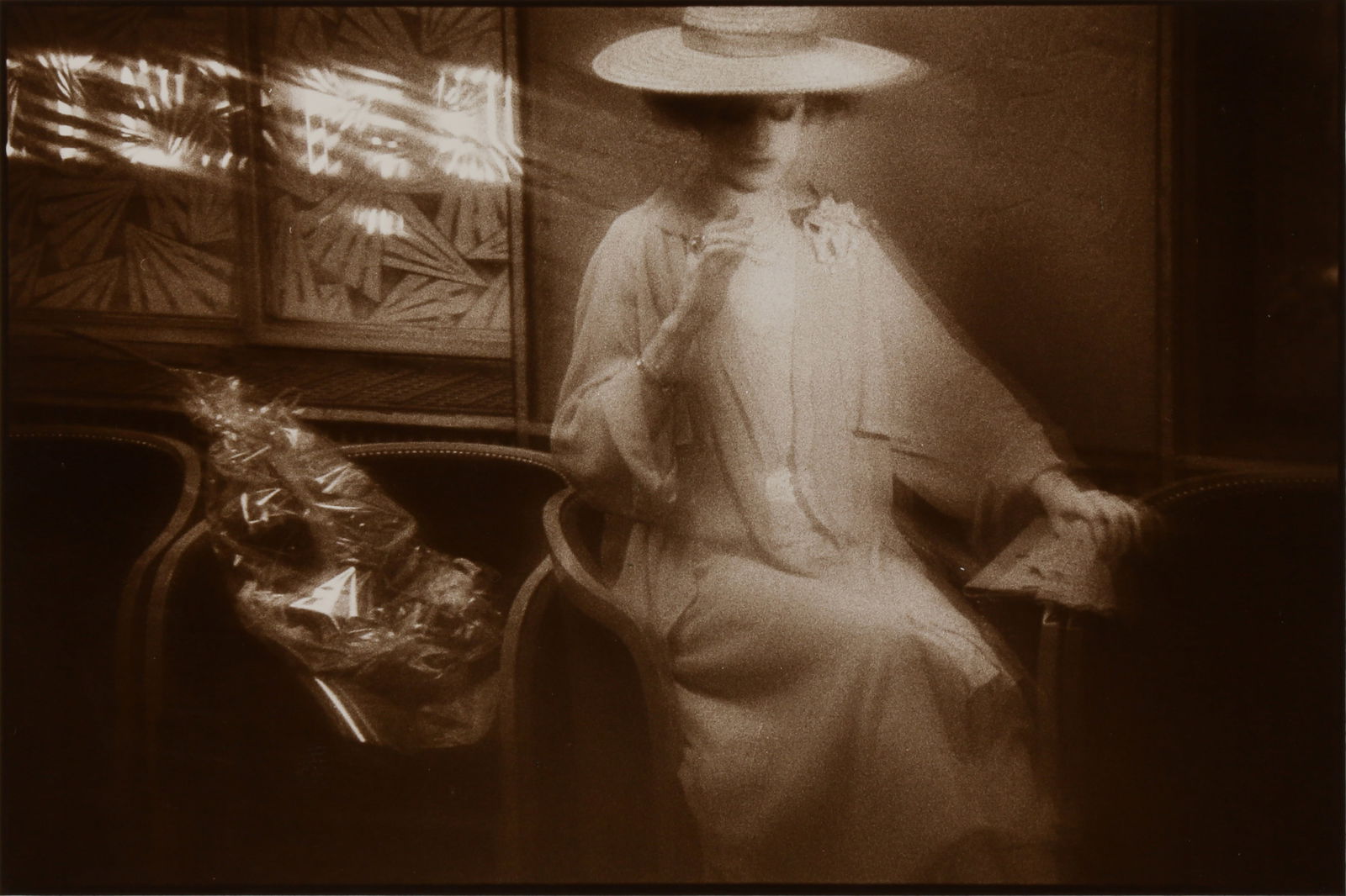 § Sarah Moon (b.1941): Sarah Moon (b.1941) UNTITLED [PIMMS], 1979. Vintage silver gelatin print, image size 15.5 x 22.7cm, sheet size 24 x 29.7cm, signed, titled, and dated by the photographer in pencil verso.