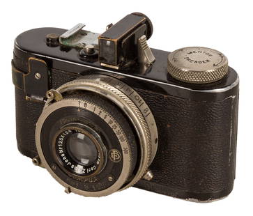 A Mentor Dreivier 127 Film Camera: A Mentor Dreivier 127 Film Camera Serial No: 55394 Date: c.1930 Body: VG Shutter: working Lens: Carl Zeiss 5cm f/3.5 Tessar (1253124) Optics: G/VG Notes: A rare German film camera designed to take 16