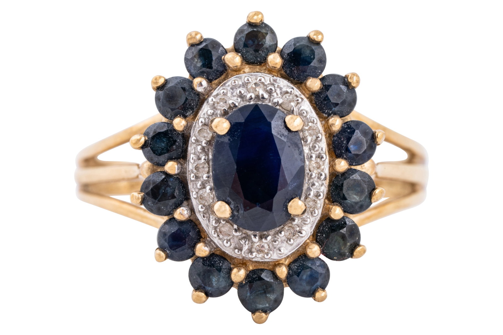 A sapphire and diamond halo ring: A sapphire and diamond halo ring Set with an oval-cut and a row of circular-cut sapphires, surrounding a middle row of single-cut diamonds, to trifurcated shoulders, set in 9ct yellow gold, maker's ma