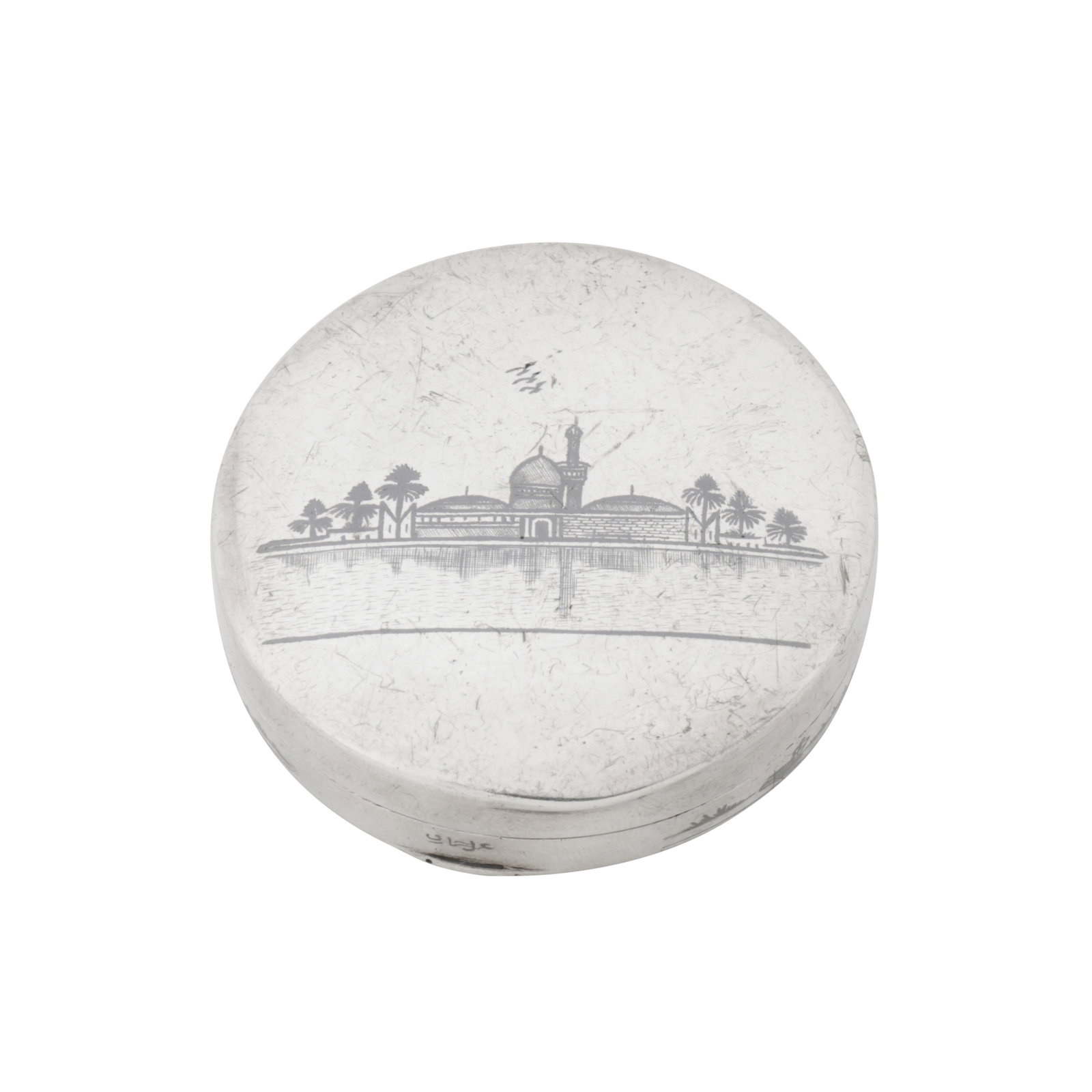 Omara circa 1930, signed Hommadi An early 20th century Iraqi silver and niello compact: Omara circa 1930, signed Hommadi An early 20th century Iraqi silver and niello compact Of short cylindrical form. The lid with neillo scene of the Abu Hanifa al in Nu'man, Baghdad, with river scene of