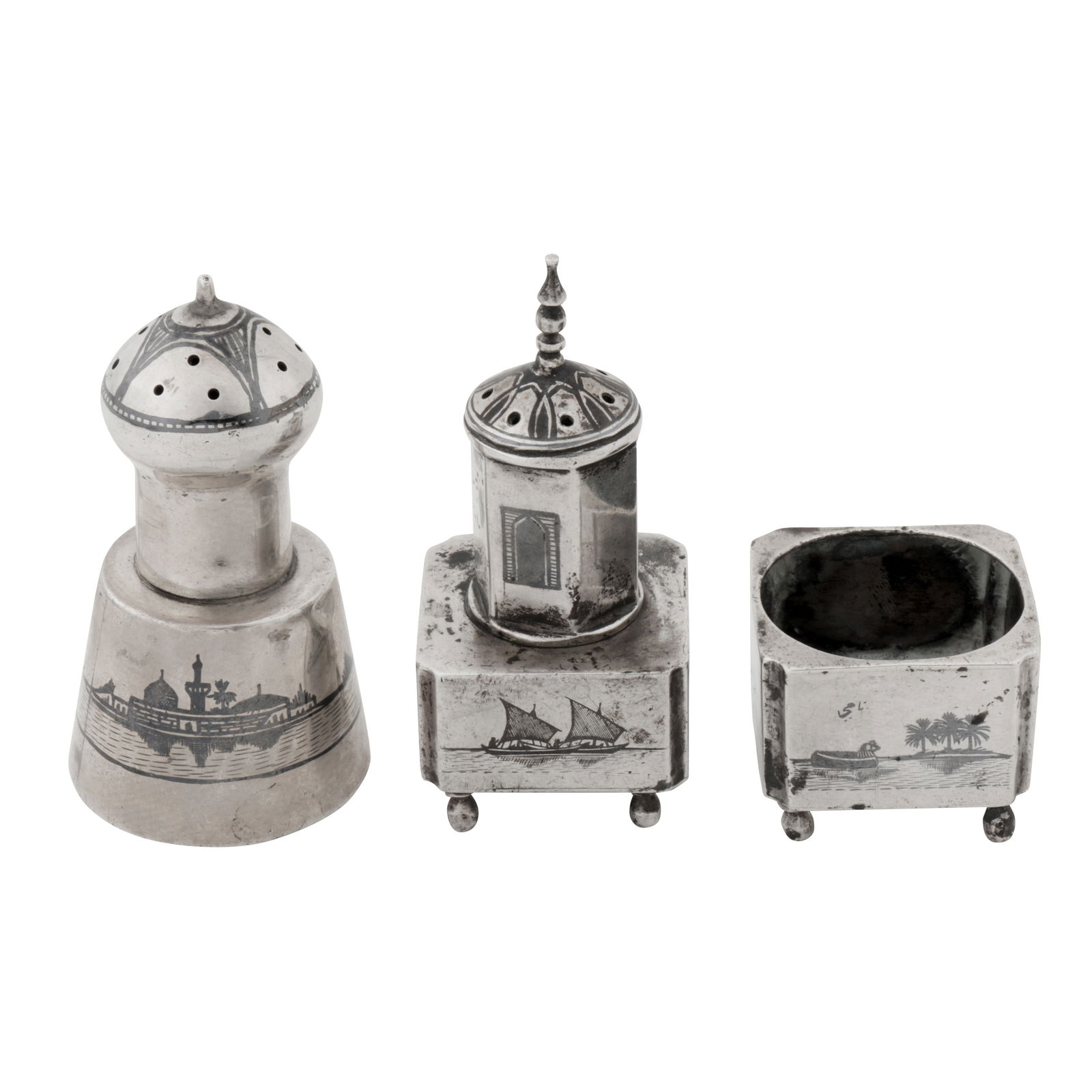 Omara circa 1930 signed Nahy An early 20th century Iraqi silver and niello part – cruet set: Omara circa 1930 signed Nahy An early 20th century Iraqi silver and niello part – cruet set Comprising a pepper pot and salt. The pepper of minaret form, typical niello decoration, including the