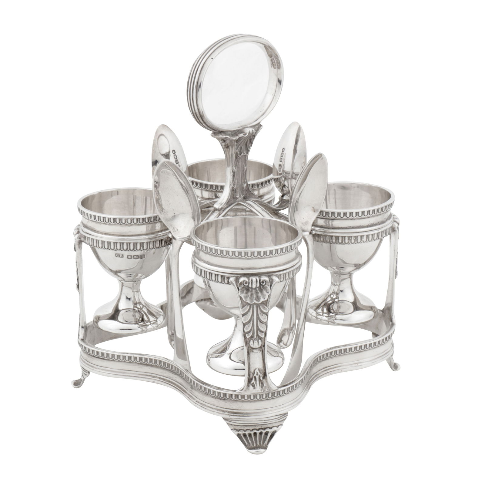 Sheffield 1929 by George Howson A George V sterling silver egg cruet: Sheffield 1929 by George Howson A George V sterling silver egg cruet Of broadly square form with rounded edge, raised upon four fluted splay feet, the galleried rings with shell and acanthus supports,