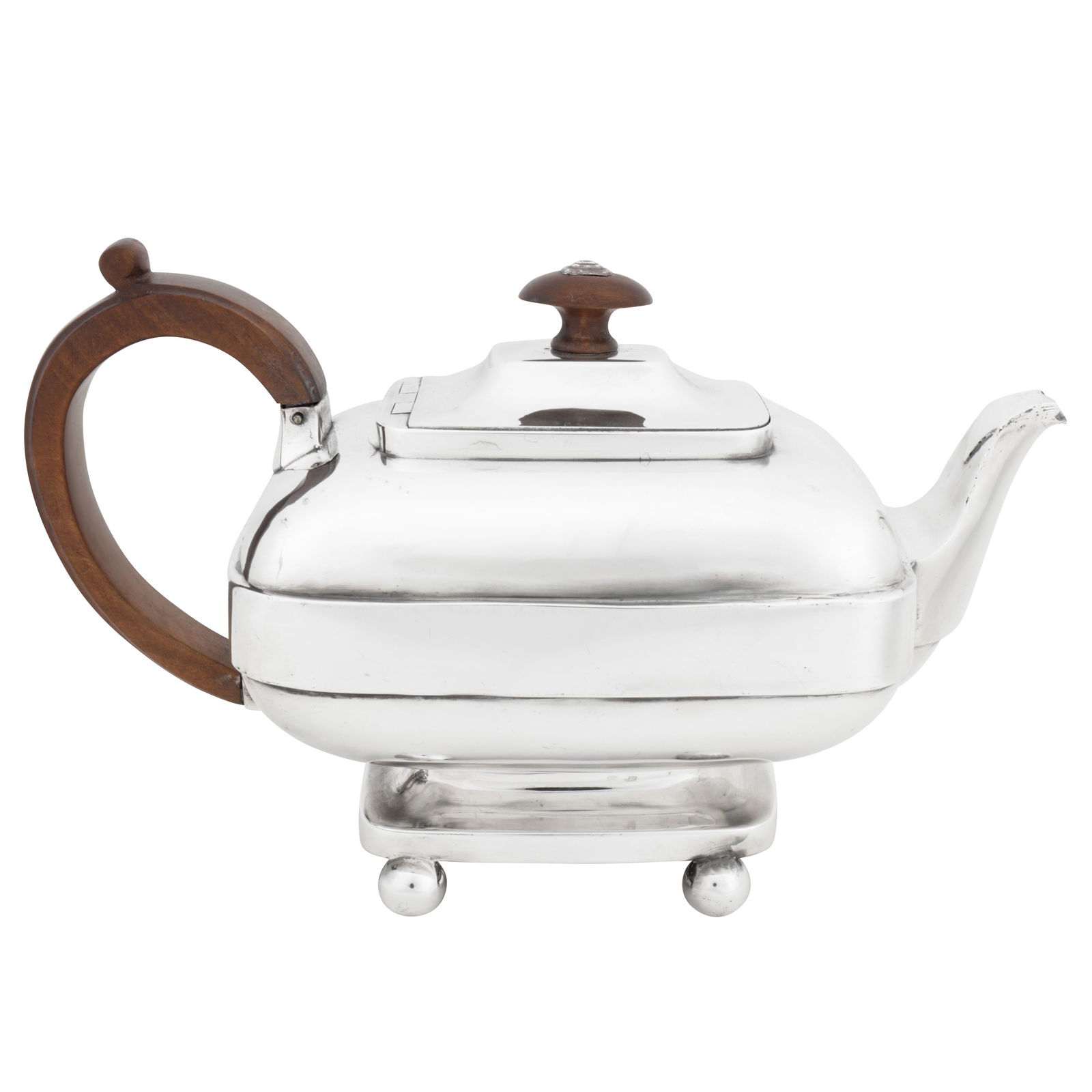 York 1815-17 by James Barber and William Whitwell (ceased 1823) A George III provincial sterling: York 1815-17 by James Barber and William Whitwell (ceased 1823) A George III provincial sterling silver teapot Of oblong rounded form, upon a spreading base upon four ball feet. A short curved spout o