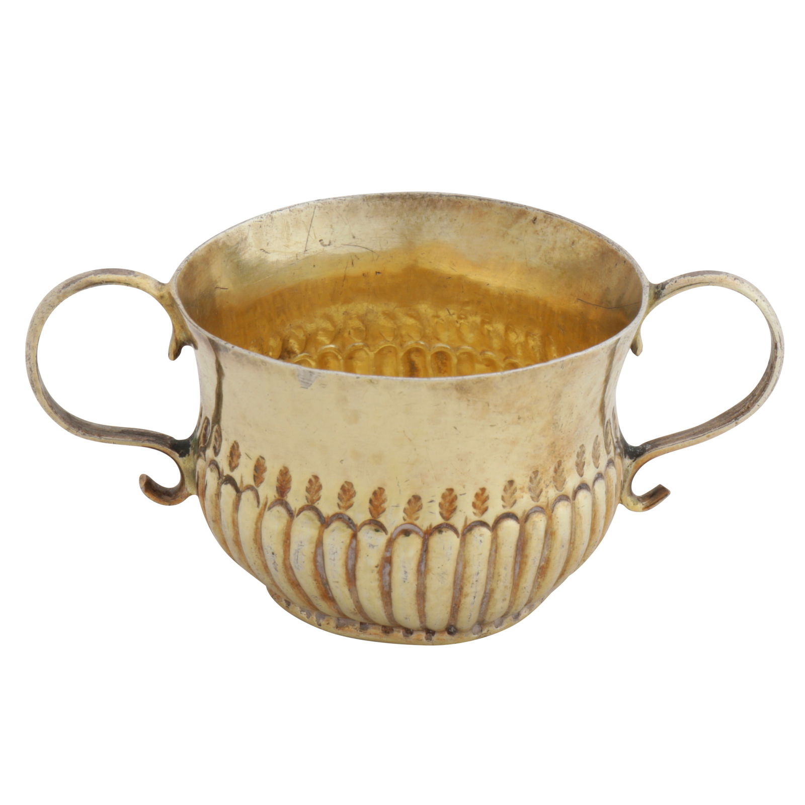 London 1708 by CO, probably John Cole A Queen Anne Britannia standard silver gilt toy or miniature: London 1708 by CO, probably John Cole A Queen Anne Britannia standard silver gilt toy or miniature porringer Circular form, twin wire work handles, with half-spiral fluted decoration to the body with