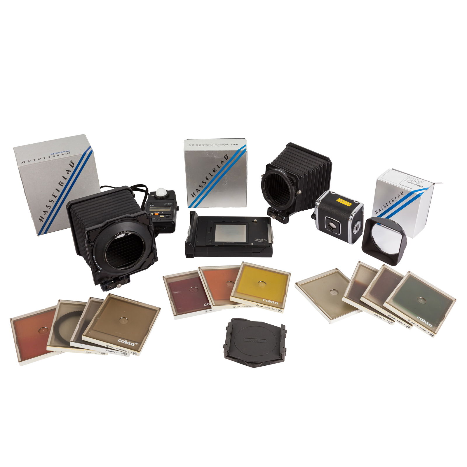 A Good Selection of Hasselblad Accessories: A Good Selection of Hasselblad Accessories Including a boxed A12 Film back (3321954), a Polaroid back, two boxed Hasselblad Proshades 6093T and 40676, a selection of Hasselblad straps and cable releas
