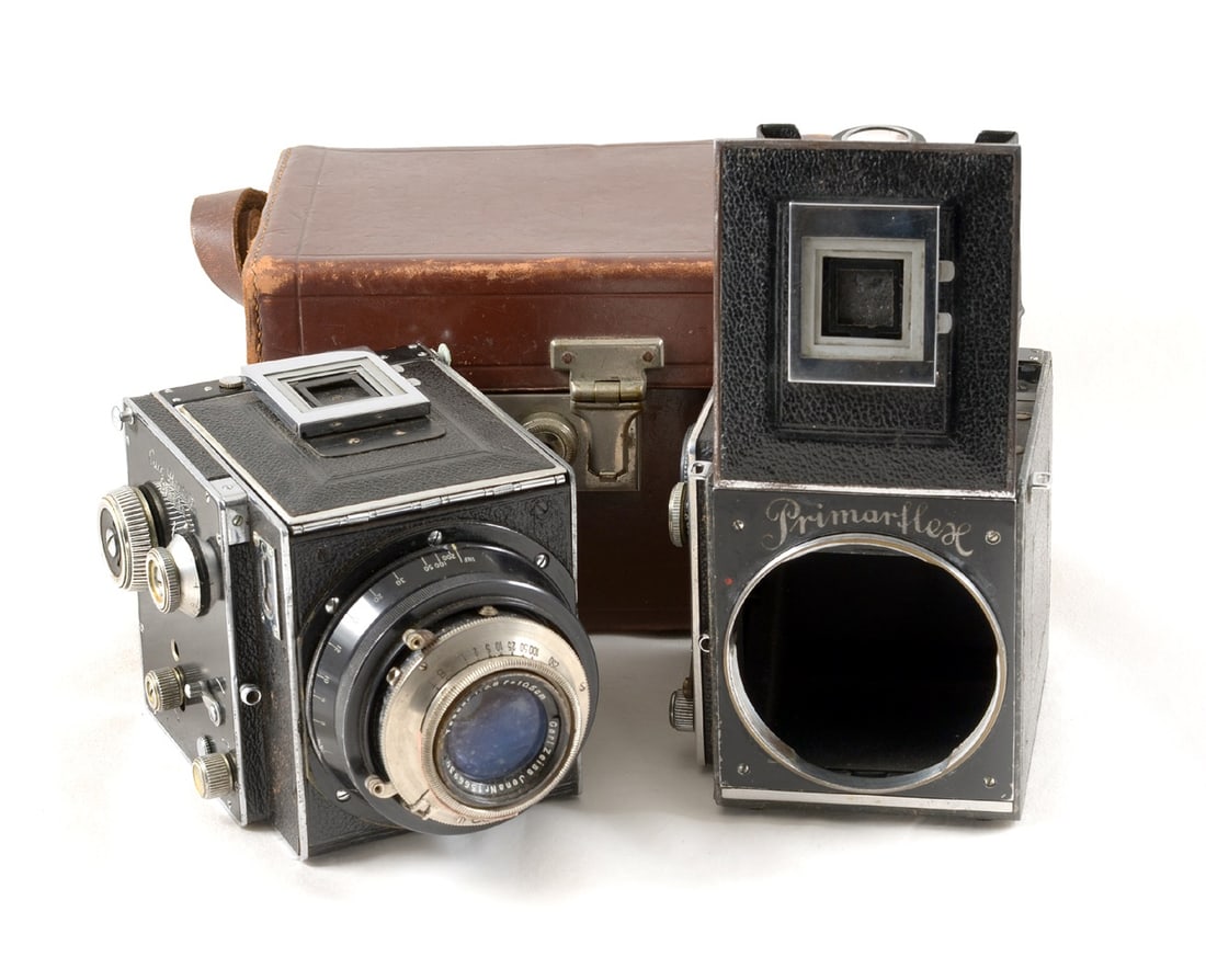 Curt Bentzin Primaflex 120 SLR Camera, Pre-WWII.: #26874 (signs of normal use) fitted with a CZJ 10.5cm f3.5 Tessar lens in a Compur shutter (firing). Also body #28554, shutter and mirror not firing, blinds temperamental/sticking so offered "as seen"