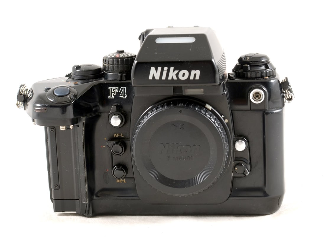 Nikon F4 Film Camera, Incomplete.: Body #2174637. Signs of normal use but unable to check any operations as missing battery holder/cover. As seen only.ody #2174637. Signs of normal use but unable to check any operations as missing batt