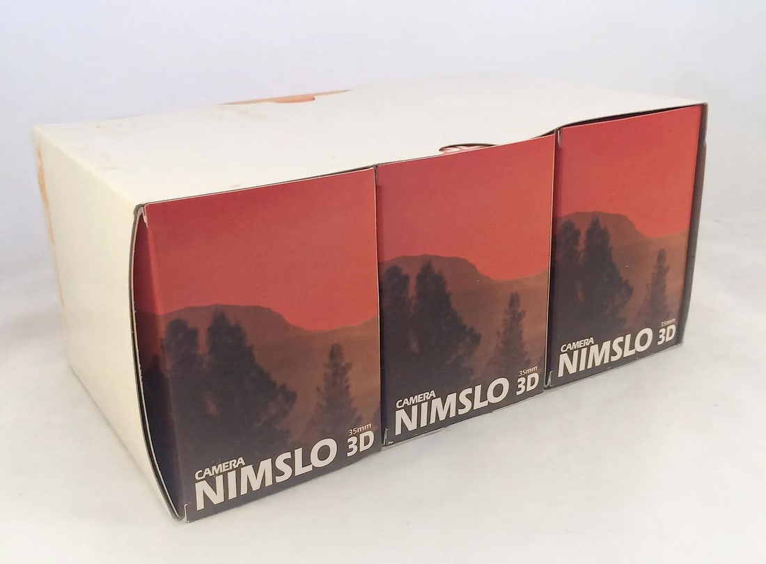 3 Nimslo Lenticular 3D Cameras, NOS: New, old stock from long-term storage after delivery direct from the Scottish factory. One with shutters firing (new batteries needed) and two shutters not firing. Boxed, with strap and instruction bo
