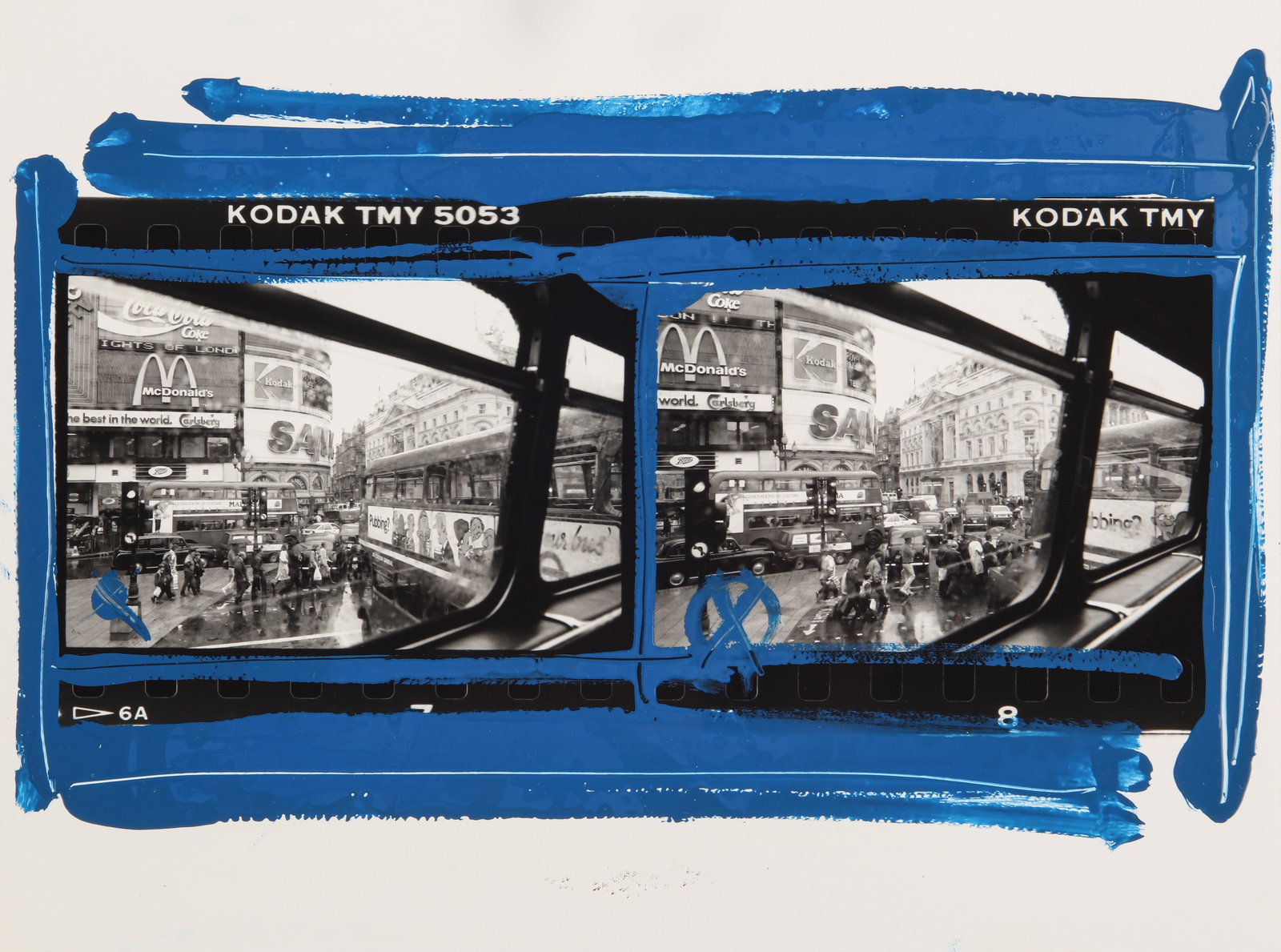 William Klein (1926-2022) Piccadilly Circus, London, 1983: Unique vintage silver gelatin print, with blue enamel paint borders, image size 13 x 23cm, sheet size 18 x 24cm, titled by the photographer in ink verso, with Klein's rue de Medicis studio stamp verso