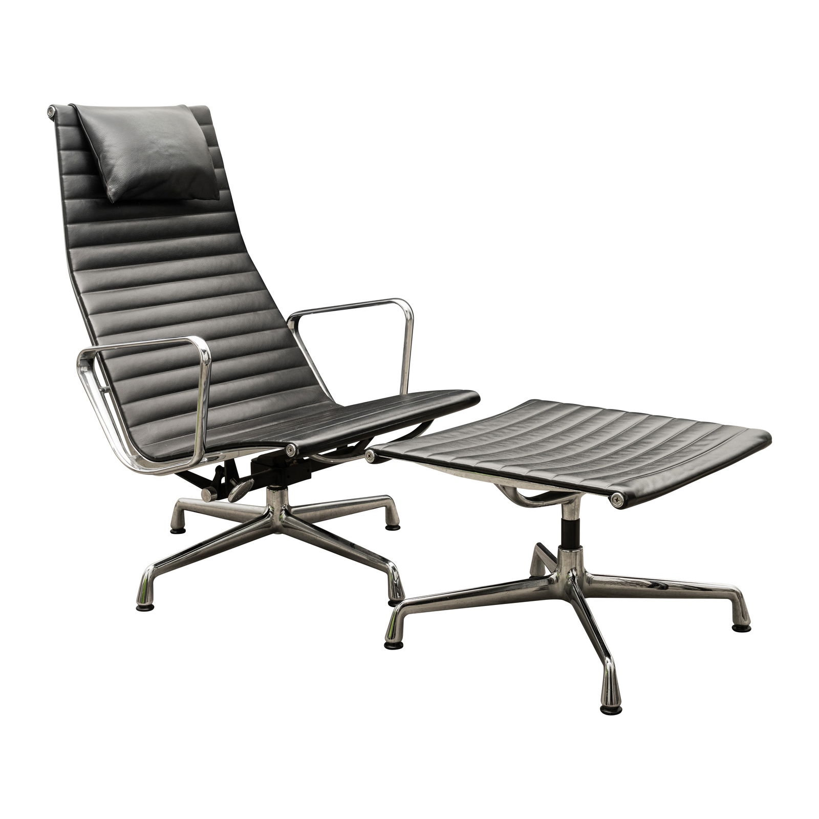 Charles and Ray Eames, American EA124 Chair and Ottoman: Originaly designed 1958, this model later Leather upholstery, aluminium Fabric Charles and Ray Eames label and Vitra applied label to underside Chair: 101cm high x 63.5cm wide x 64cm deep Ottoman: 43c