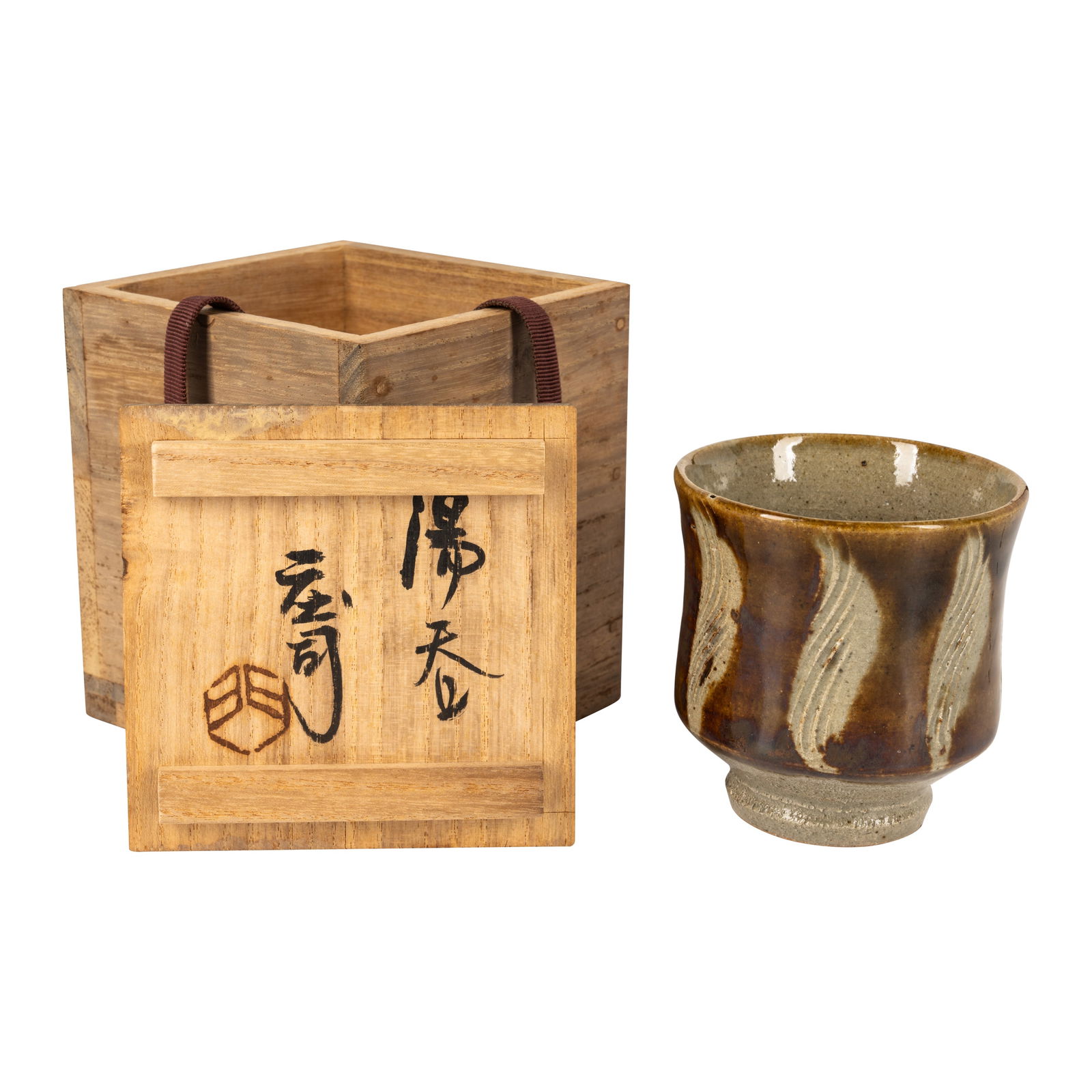 § Shoji Hamada (Japanese 1894-1978) Yunomi (tea bowl) with incised decoration: Circa 1960 Glazed stoneware Together with a signed wooden box 8.5cm high