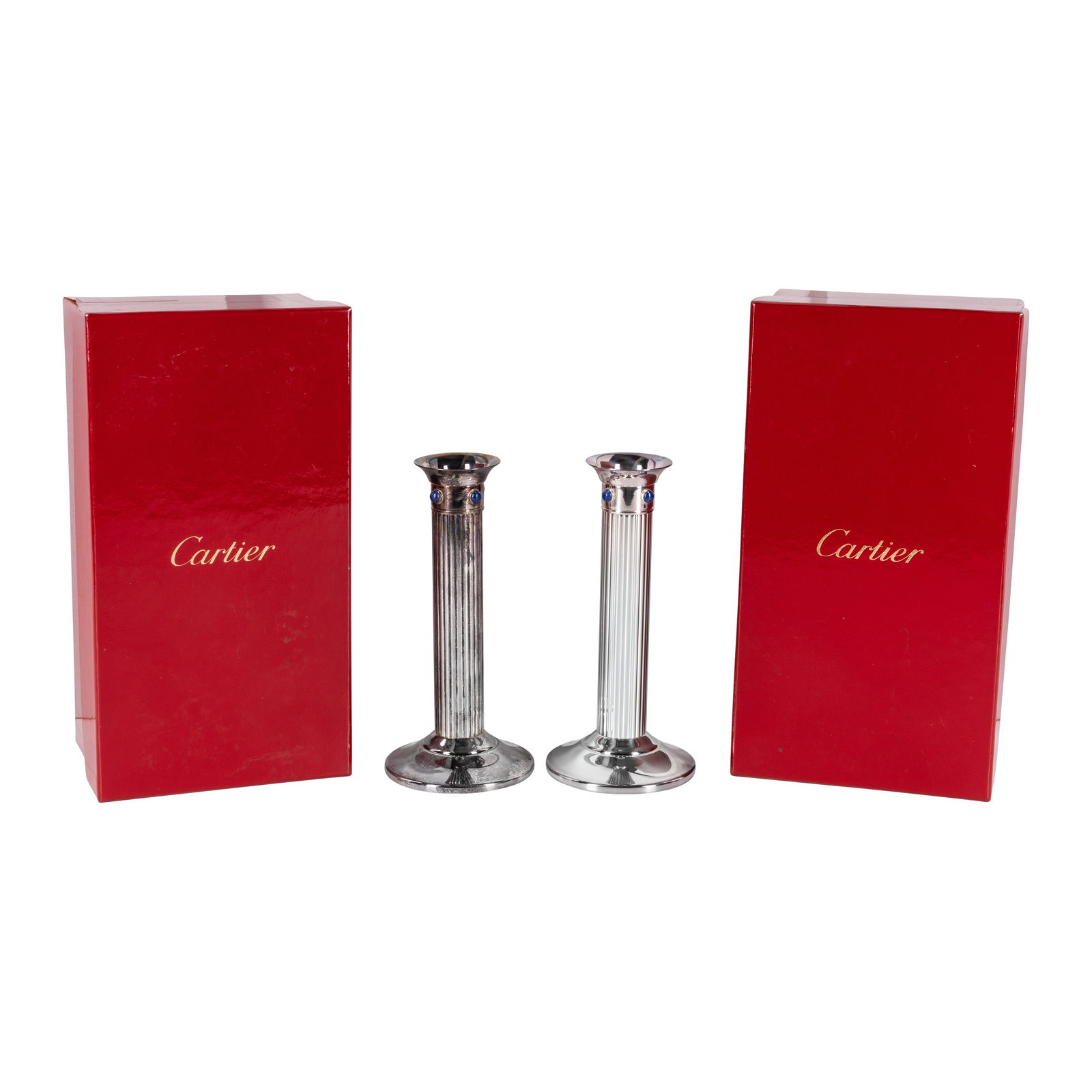 Cartier, Paris Pair of Candlesticks: 1989 Silver plate, Lapis Lazuli Cabocohons Stamped 'Cartier Made in France 1989' to underside 16cm high