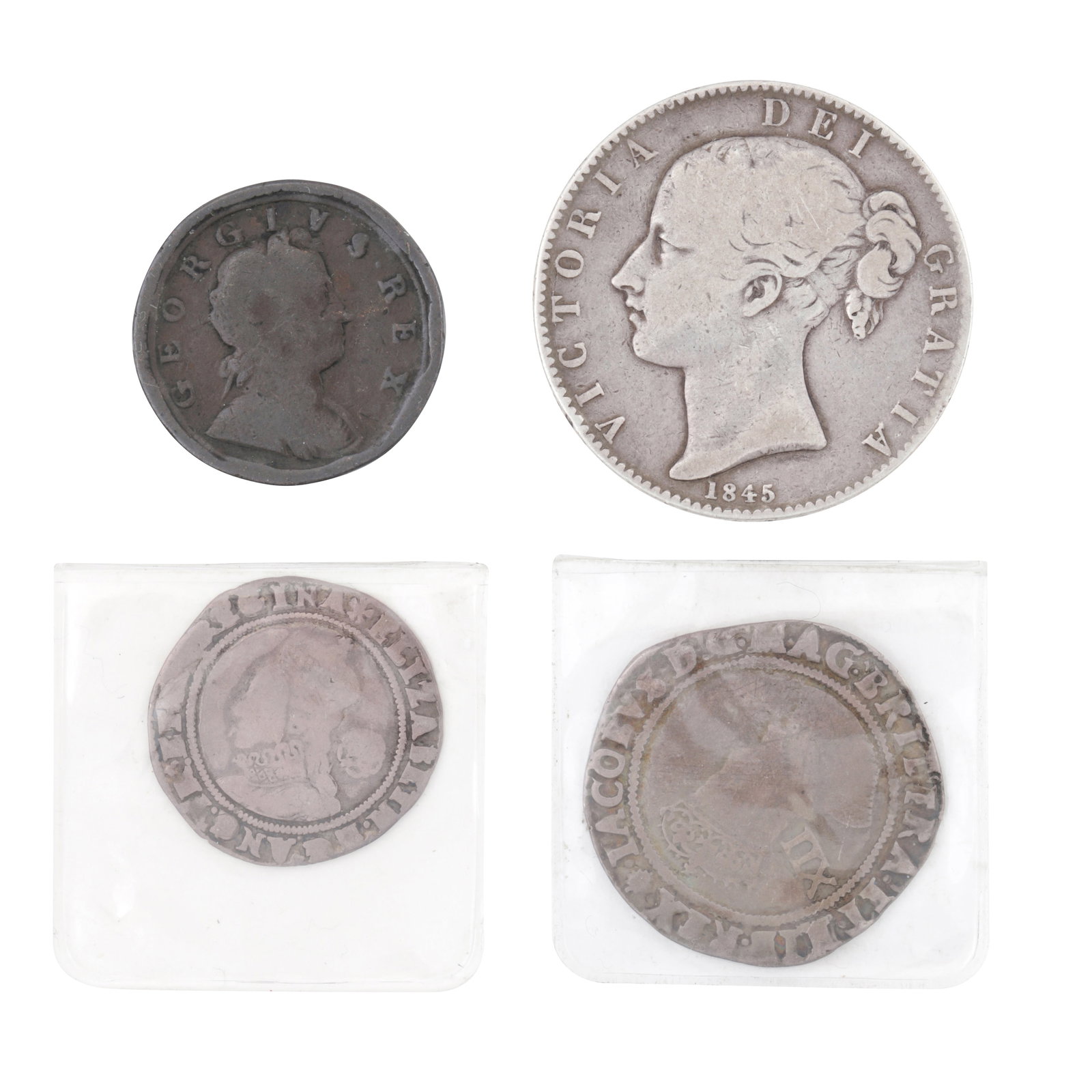 Group of four British coins, (1 of 2)