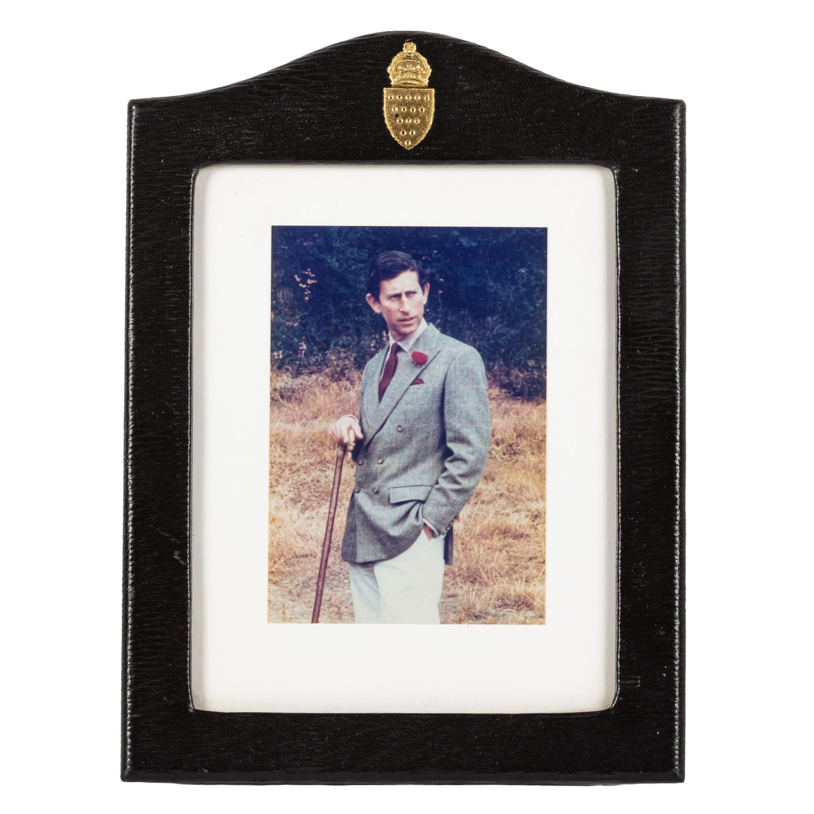 Charles III, King of the United Kingdom Royal presentation photograph: Charles III, King of the United Kingdom Royal presentation photograph The image depicting the Prince of Wales during a walk in the outdoors, unsigned, in original leather frame by Soos, featuring