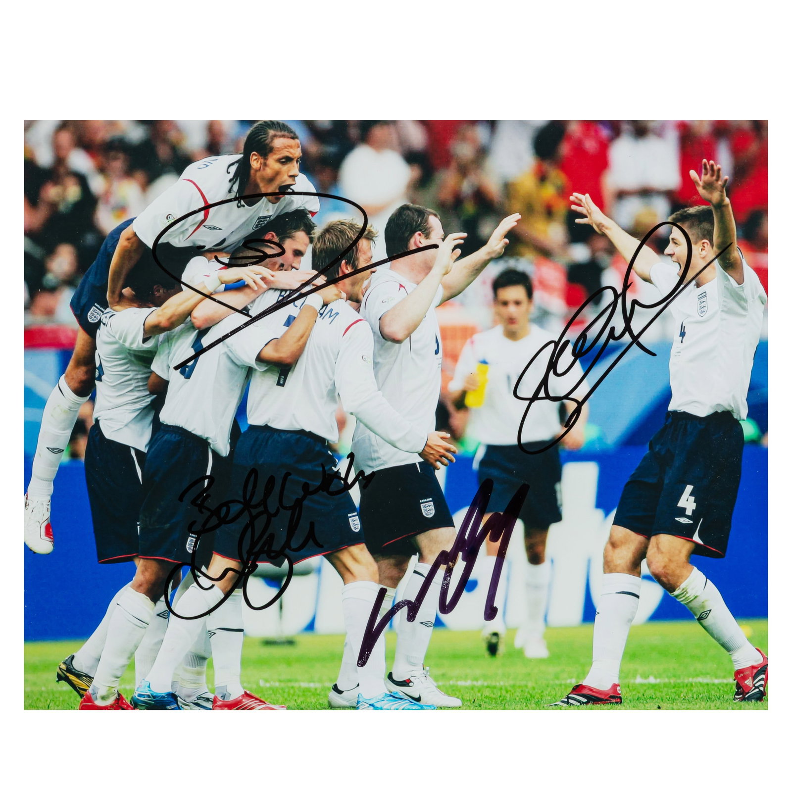 England Football Team .- Incl Beckham Signed photograph: England Football Team .- Incl Beckham Signed photograph Colour photograph of the English team celebrating after Beckham score the opening goal in the match against Ecuador in the 2006 World Cup,