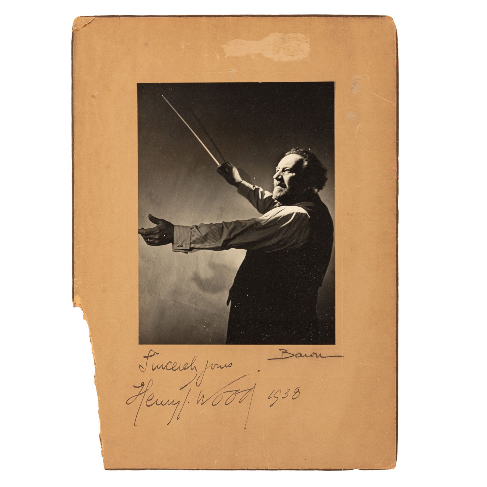 Wood (Henry J.) Signed photograph: Wood (Henry J.) Signed photograph Black and white, three quarter length photograph by Baron showing Wood while conducting, signed "Sincerely yours Henry J. Wood 1938" on lower mount, additionally