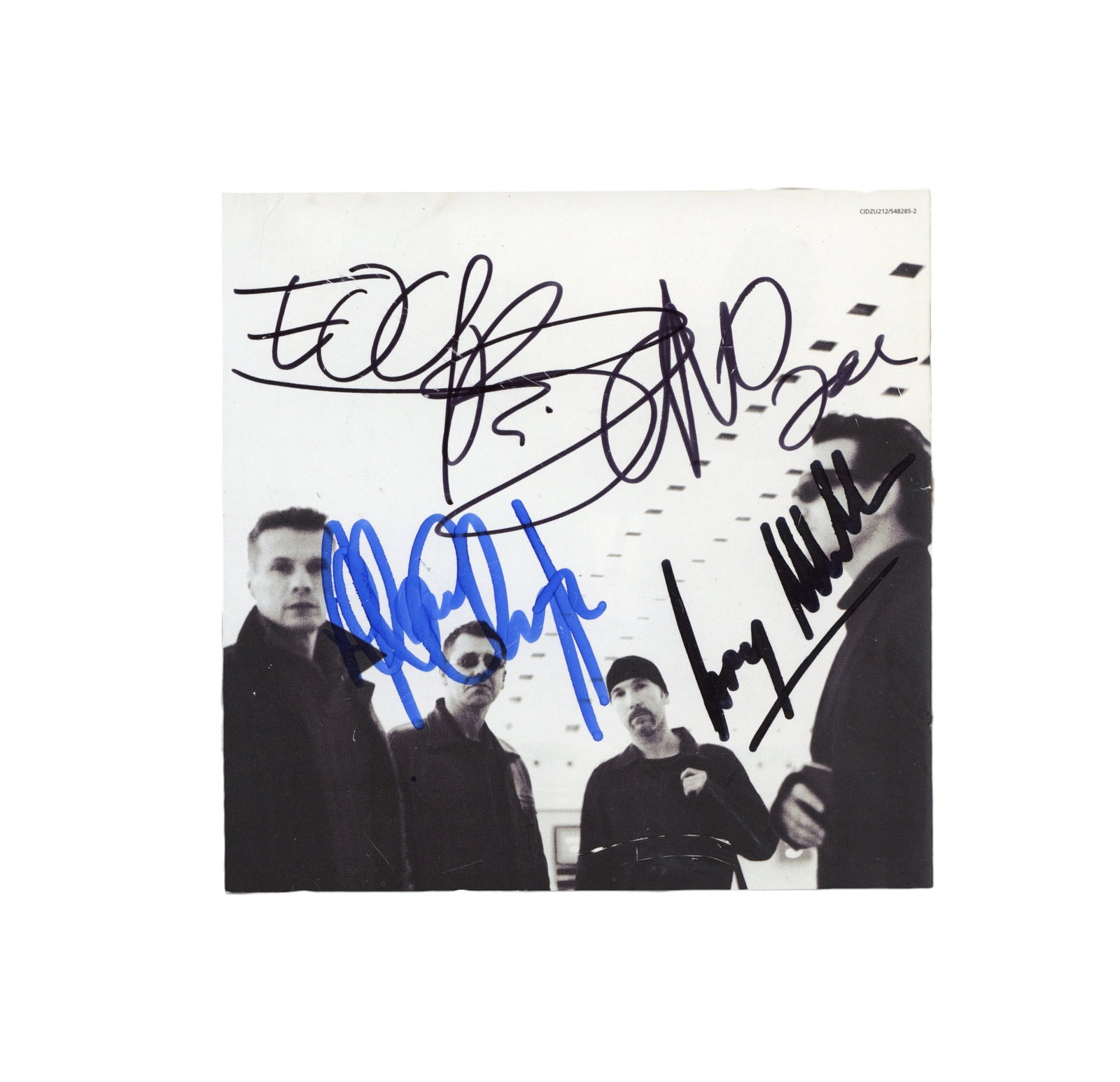 U2 Signed CD lyric booklet: U2 Signed CD lyric booklet All That You Can't Leave Behind Cd lyric booklet signed in various inks by Bono, Edge, Adam Clayton and Larry Mullen, light handling wear, affixed onto cardboard mount. ***