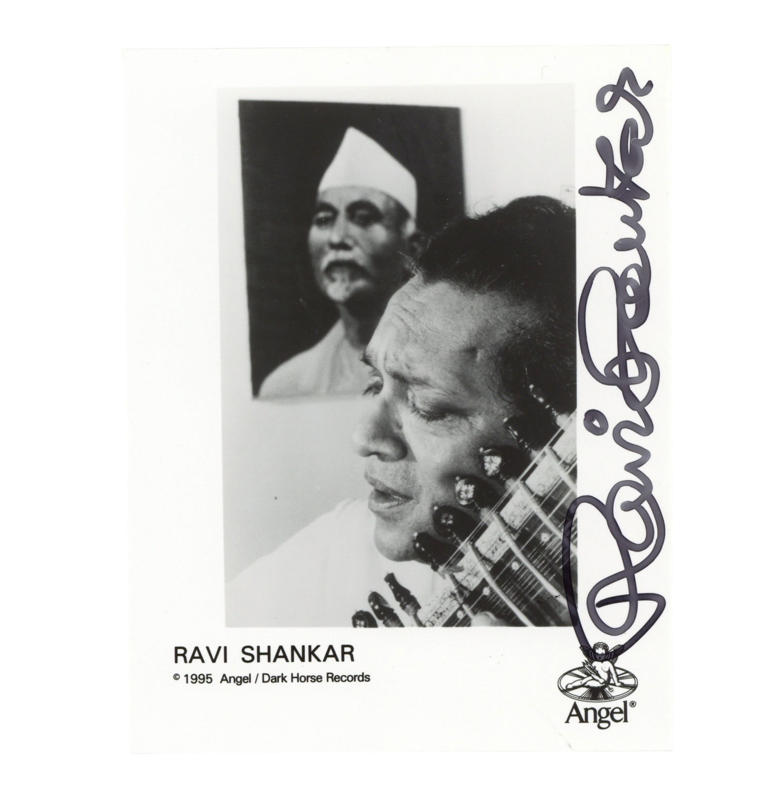Shankar (Ravi) Signed promotional photograph: Shankar (Ravi) Signed promotional photograph A black and white promotional photograph issued by Angel / Dark Horse Records, boldly signed by Shankar in black ink, in fine condition. ***Indian