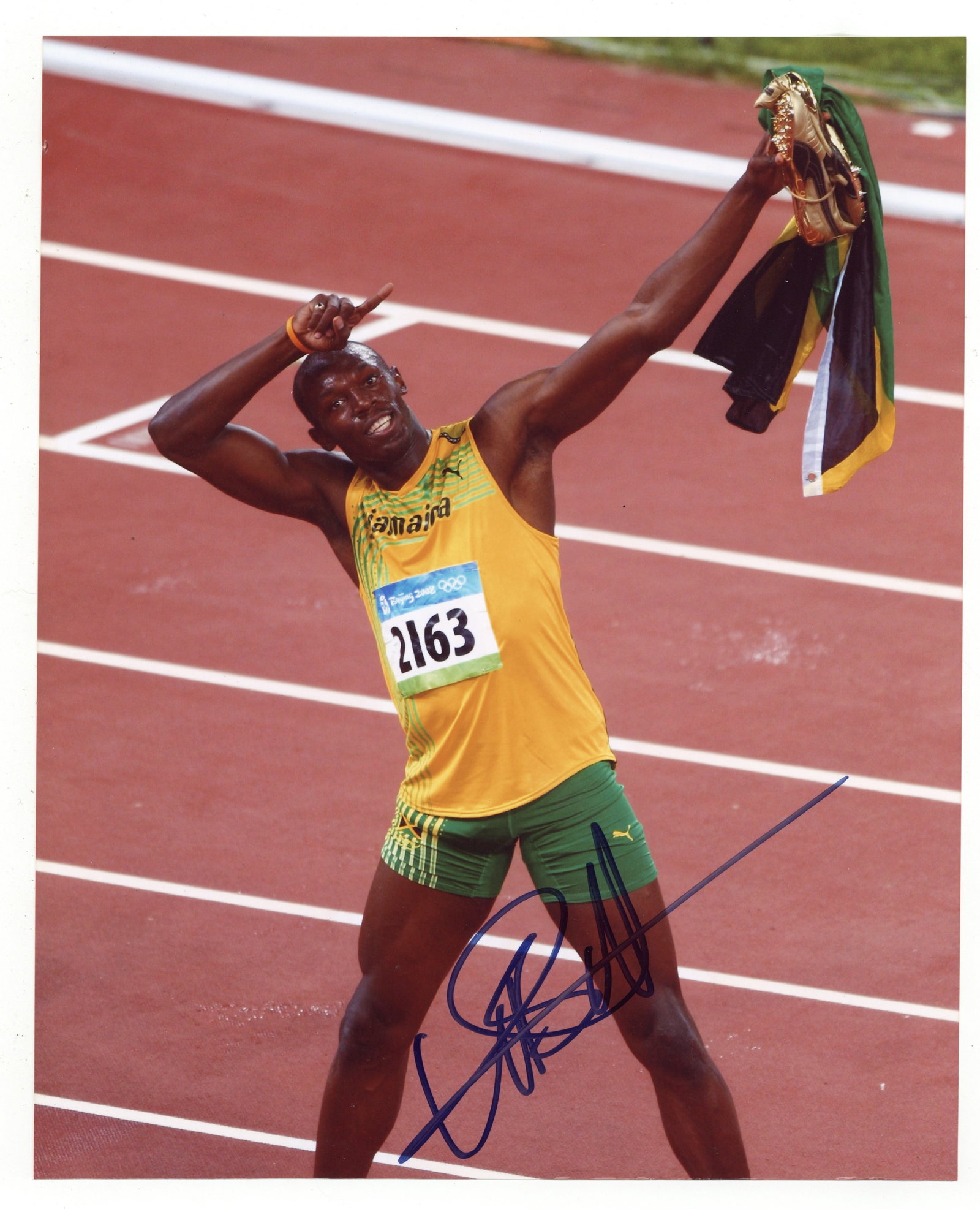 Bolt (Usain) Signed photograph: Bolt (Usain) Signed photograph Colour glossy photograph of Bolt after his historic 100-meter win at the 2008 Beijing Olympics, signed in black felt tip. Dimensions:10 x 8"/ 25.5 x 20.5cm