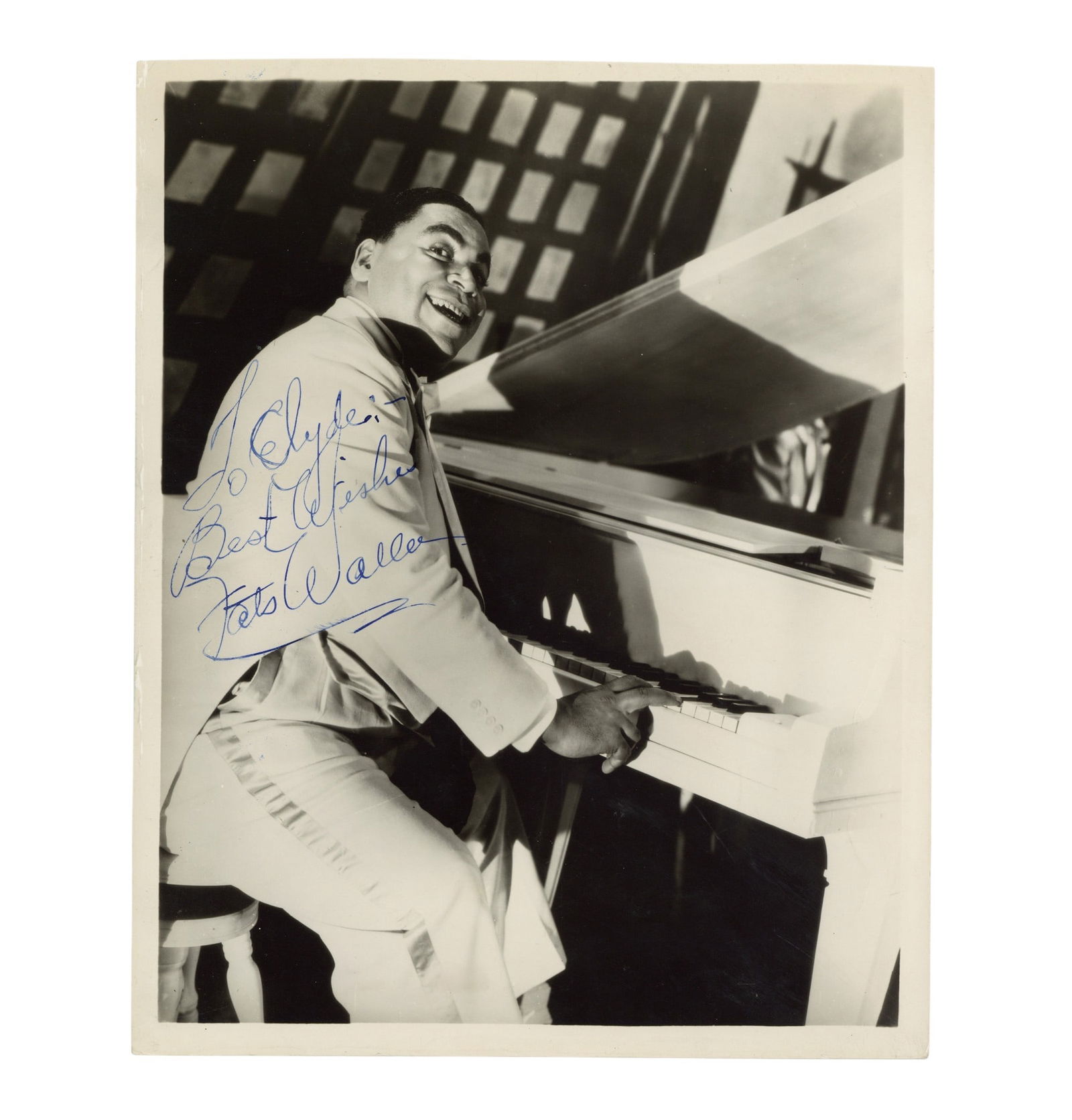 Waller (Thomas 'Fats') Signed photograph: Waller (Thomas 'Fats') Signed photograph Glossy black and white photograph of Waller playing the piano, signed and inscribed in blue ink "To Clyde, Best wishes, Fats Waller", some handling wear and