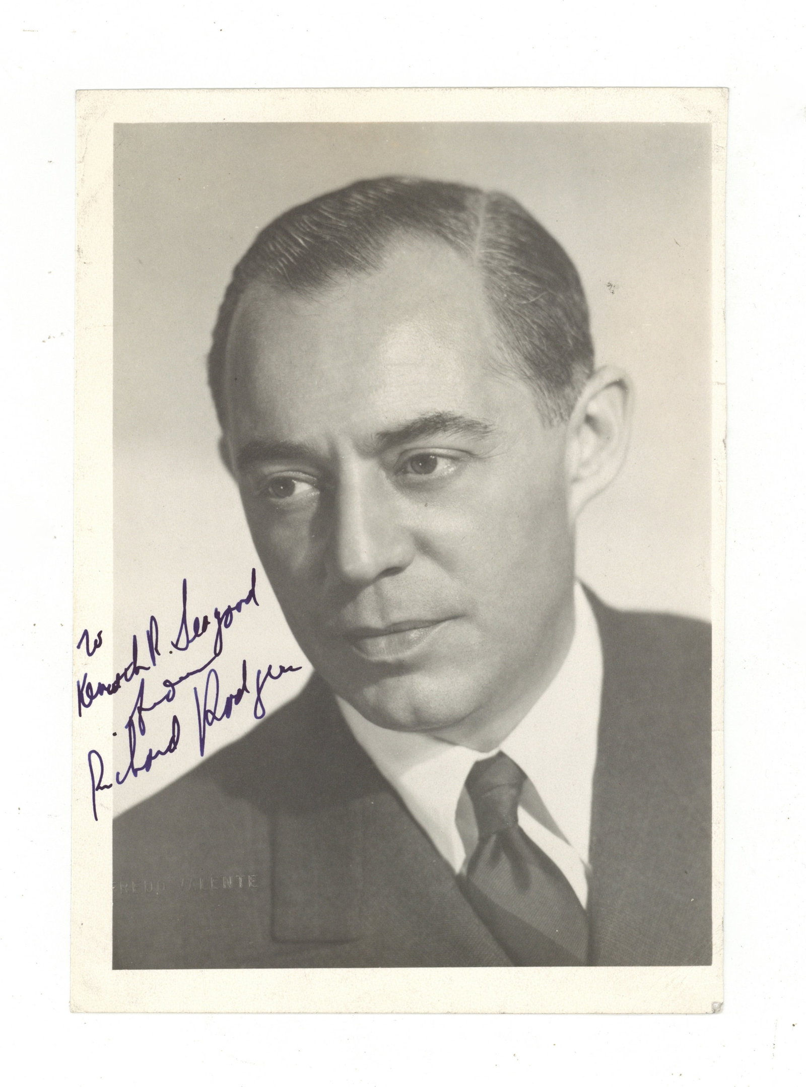 Rodgers (Richard) Signed photograph: Rodgers (Richard) Signed photograph Vintage matte-finish head and shoulders photograph of the great Broadway composer, signed and inscribed "To Kenneth R. Seagood from Richard Rodgers", some