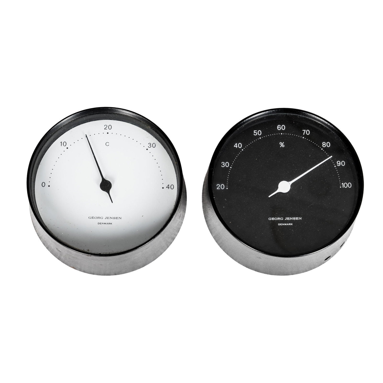 Georg Jensen, Denmark Two small wall clocks: Georg Jensen, Denmark Two small wall clocks Metal, glass Marked 'Georg Jensen, Denmark' to the faces 9.5cm diameter