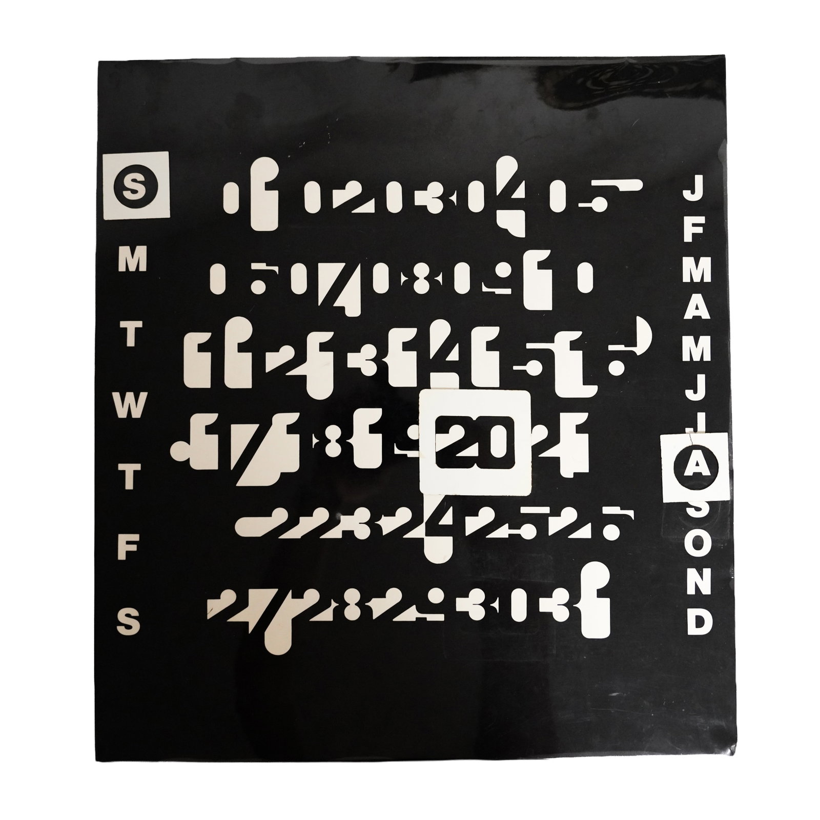 Made by Miscellania after a design by Jean Pierre Vitrac (French b.1944) 'Silhouette' perpetual cale: Made by Miscellania after a design by Jean Pierre Vitrac (French b.1944) 'Silhouette' perpetual calendar after the 'Imbroglio' design 1970s White and black lacquered metal and plastic, card packaging