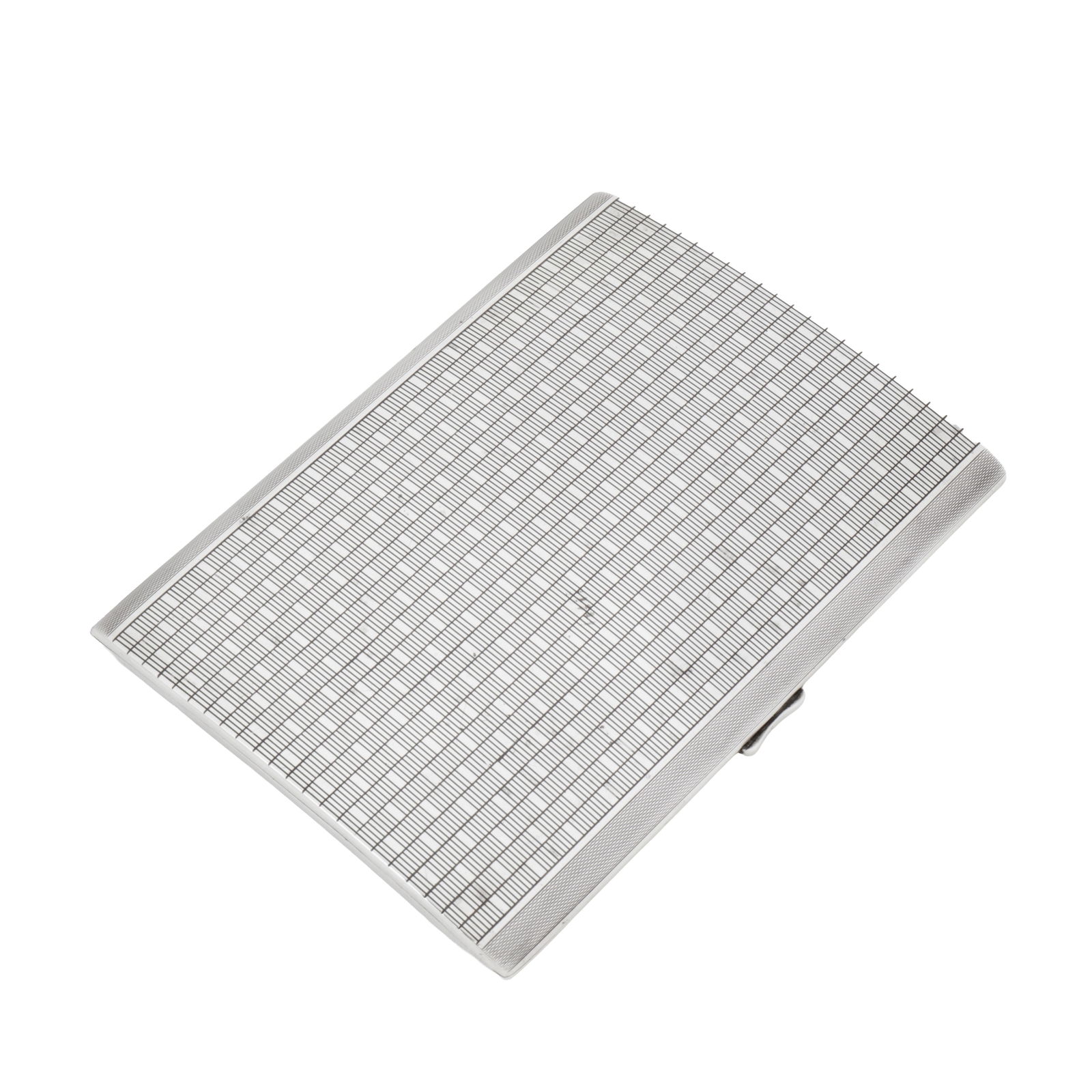 French or German with import marks for London 1935 by Alfred Dunhill An early 20th century sterling: Of curved rectangular form with a push button release. Linear enamel decoration flanked by engine turning. Gilt interior with two hinged arms and a divider. Fully and part marked. The edge engraved DU