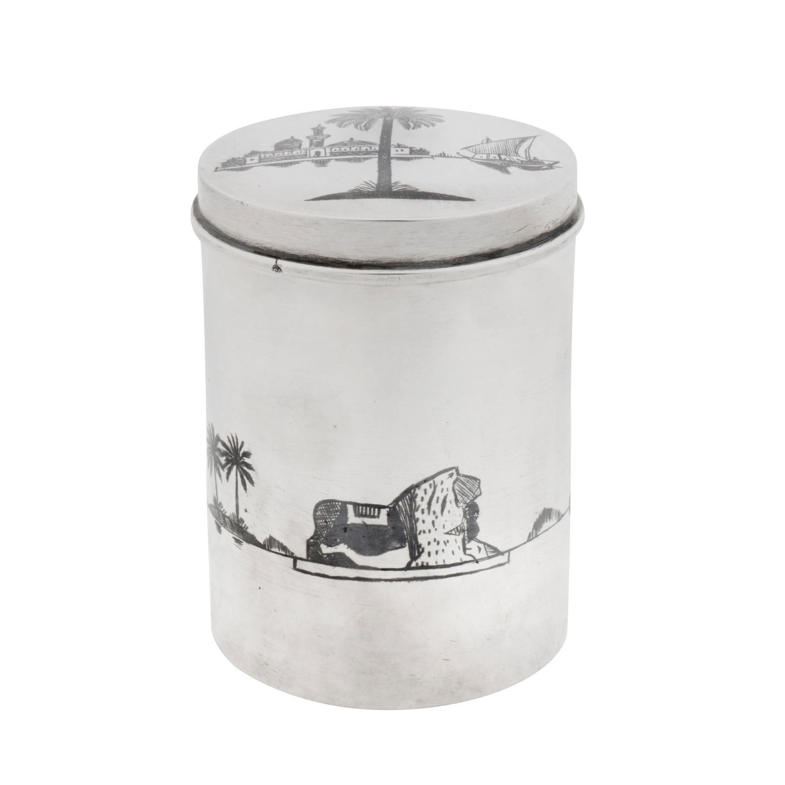 Basra circa 1960 A mid-20th century Iraqi silver and niello tea caddy or dressing table jar: Of cylindrical form and a pull off lid. The sides with niello decoration of the lion of Babylon, boatmen in gufa, and a mashoof, with date palm trees. The lid possibly with the Tomb of Sheikh Abdul Qa