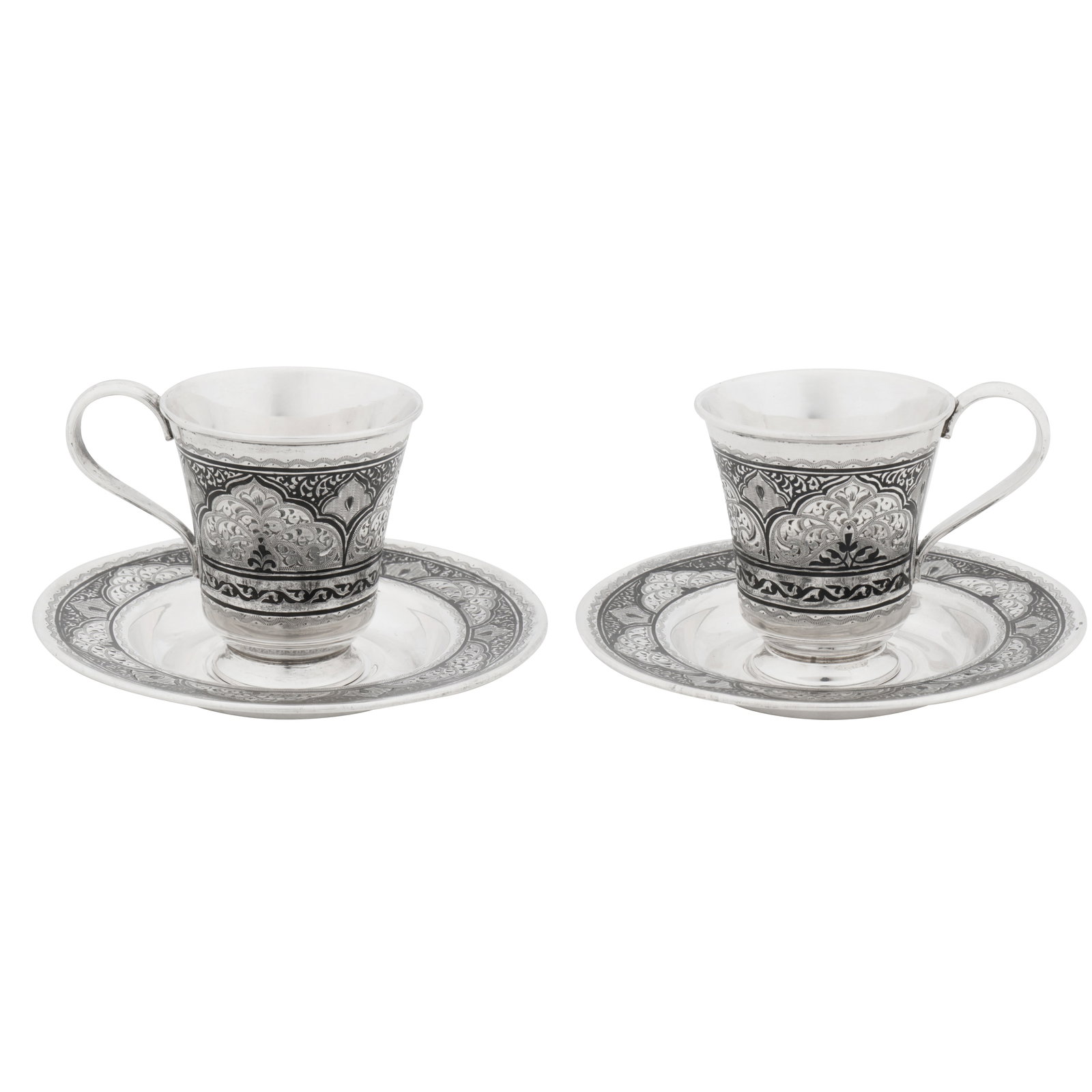 Kubachi circa 1980 A cased pair of late 20th century Russian (Dagestani) 875 silver and niello cups: Each of circular form with engraved arabesques and niello scrolls. Each marked with post-1958 soviet era control marks. Housed in original fitted case. Saucer diameter – 12.4 cm / 4.8 inches Weight
