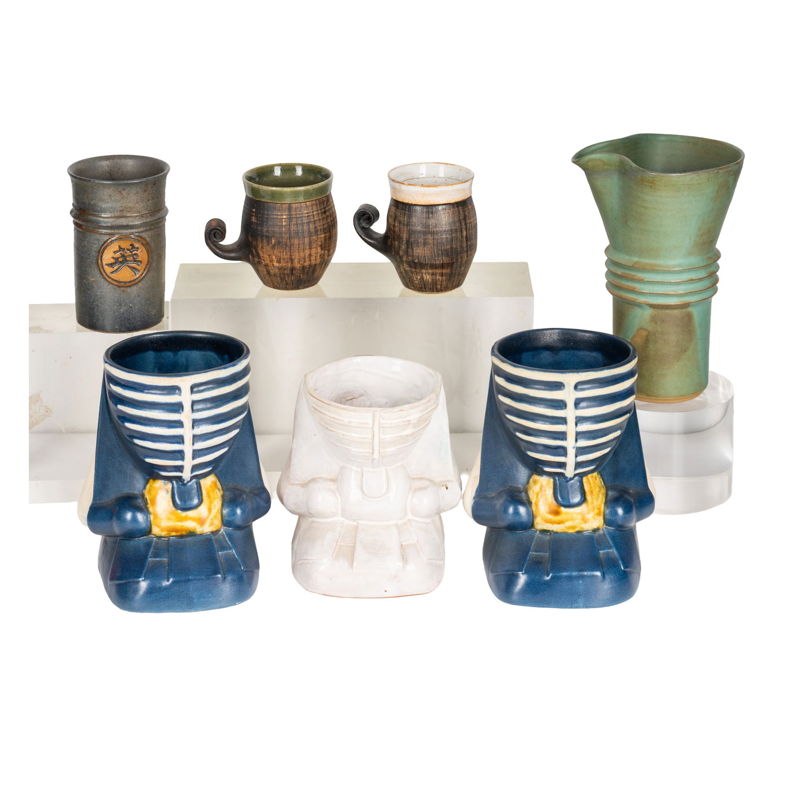 Studio pottery by various makers Ray Marshall and Deborah Hopson Wolpe: Studio pottery by various makers Ray Marshall and Deborah Hopson Wolpe Two Ray Marshall scroll handled cups in stoneware with sgraffito manganese glaze, 8cm high, two pieces of glazed stoneware potte