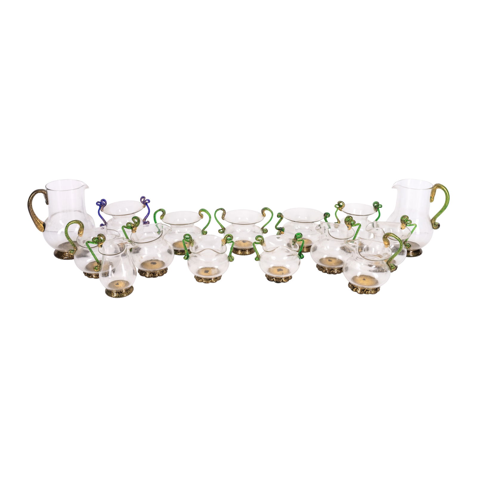 20th Century, Italy Set of Venetian twin-handled teacups and jugs: 20th Century, Italy Set of Venetian twin-handled teacups and jugs GlassUnmarkedTo comprise: 2 larger jugs5 medium jugs1 small jug5 twin-handled tea-cups of varying shapes1 twin-handled sugar b