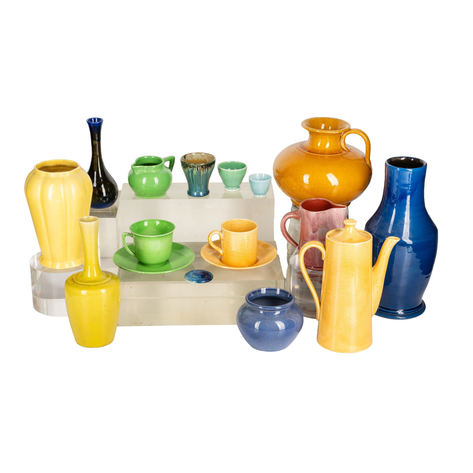 Ashtead Potters, Moorcroft, Liberty and other ceramics Various cups and saucers, coffee pot, cream j: Ashtead Potters, Moorcroft, Liberty and other ceramics Various cups and saucers, coffee pot, cream jug, vases and bowls Circa 1930Blue vase marked for 'Liberty London', a yellow Moorcroft coffee pot,