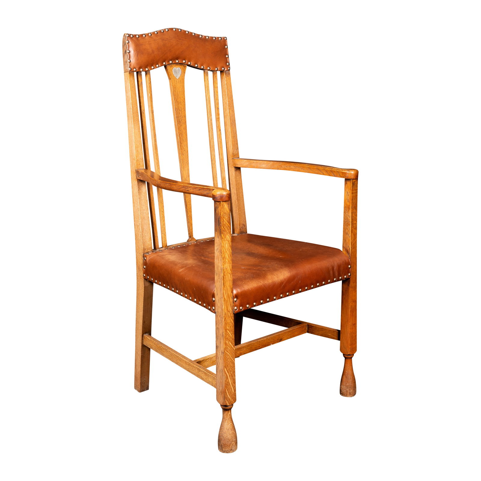 Attributed to Liberty & Co., possibly C.F.A.Voysey Arts & Crafts carver chair: Attributed to Liberty & Co., possibly C.F.A.Voysey Arts & Crafts carver chair Circa 1900Oak, leather, pewter inlaid heart114cm high x 58cm wide x 60cm deep
