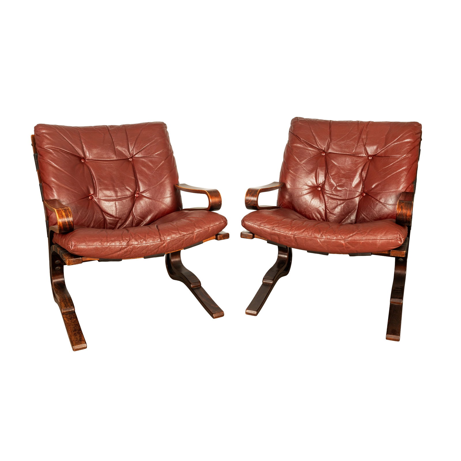 Erde and Nordahl Solheim (Norwegian, 20th Century) for Rubi Rykken Pair of 'Kengu' Lounge Chairs: Erde and Nordahl Solheim (Norwegian, 20th Century) for Rubi Rykken Pair of 'Kengu' Lounge Chairs Circa 1970s Plywood, burgundy leather upholstery 80cm high x 79cm wide x 80cm deep 