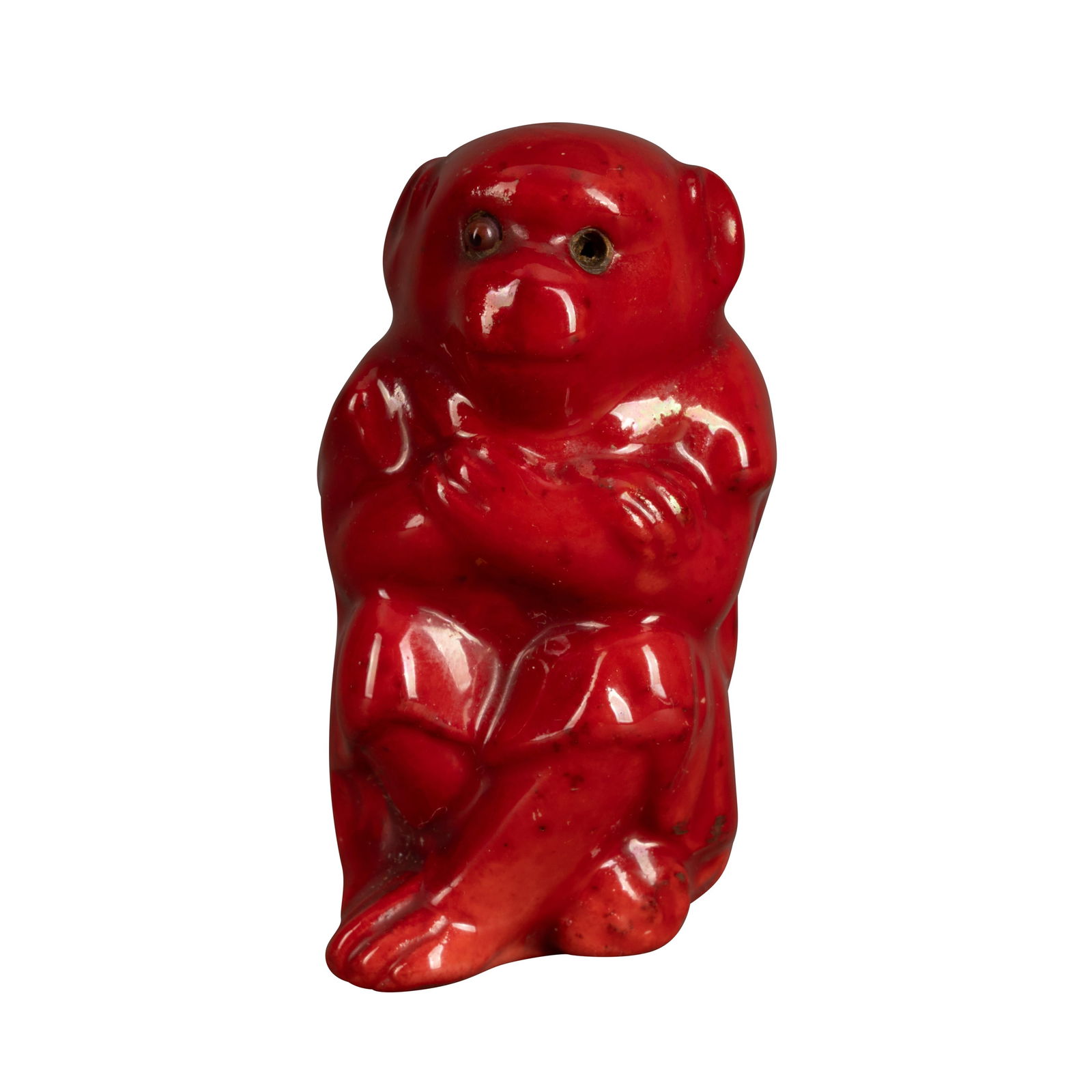 Bernard Moore (British 1850-1935) Model of a seated monkey: Bernard Moore (British 1850-1935) Model of a seated monkey Early 20th centuryRed flambe glazed earthenware, glass eyesUnderglaze painted 'BM' to interior5.5cm high