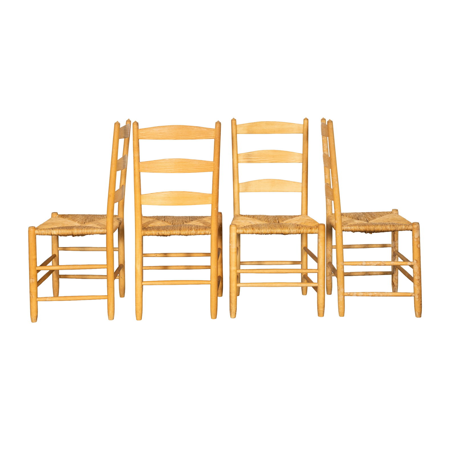 Manner of Gordon Russell Four ladderback dining chairs: Manner of Gordon Russell Four ladderback dining chairs 20th centuryOak, rush seatsUnmarked98cm high x 46cm wide x 39cm deep (4)