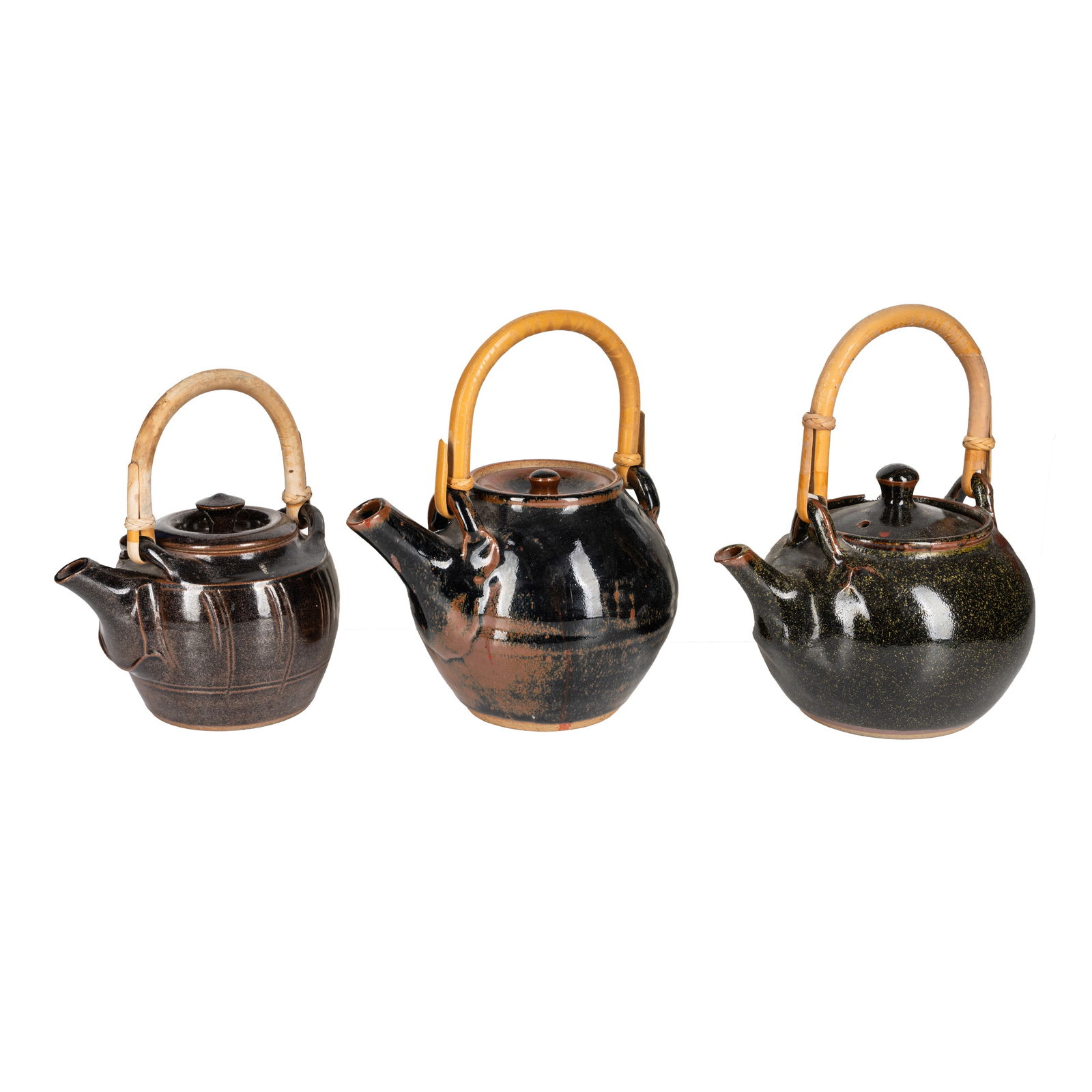 Studio pottery by various makers Three tenmoku glazed teapots with cane handle (1 of 4)
