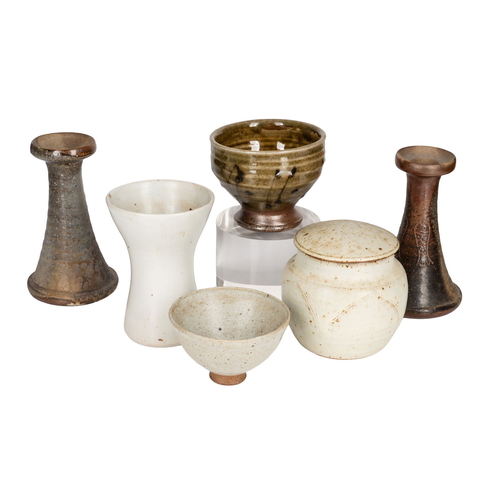 Studio pottery by various makers: Studio pottery by various makers To include: a Winchcombe Pottery jar and cover in white with incised decoration, pottery seal; a stoneware footed bowl with khaki glaze and slip decoration, unsigned,