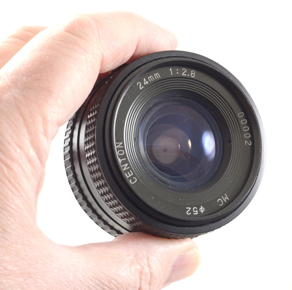 Group of FIVE 24mm Manual Focus Lenses, inc. Centon Lens #00002. Various fittings.: Group of FIVE 24mm Manual Focus Lenses, inc. Centon Lens #00002. Various fittings. Comprising a Tokina 24mm f2.8, Olympus OM fit, Sigma Super-Wide II macro focussing 24mm f2.8, Olympus OM fit,