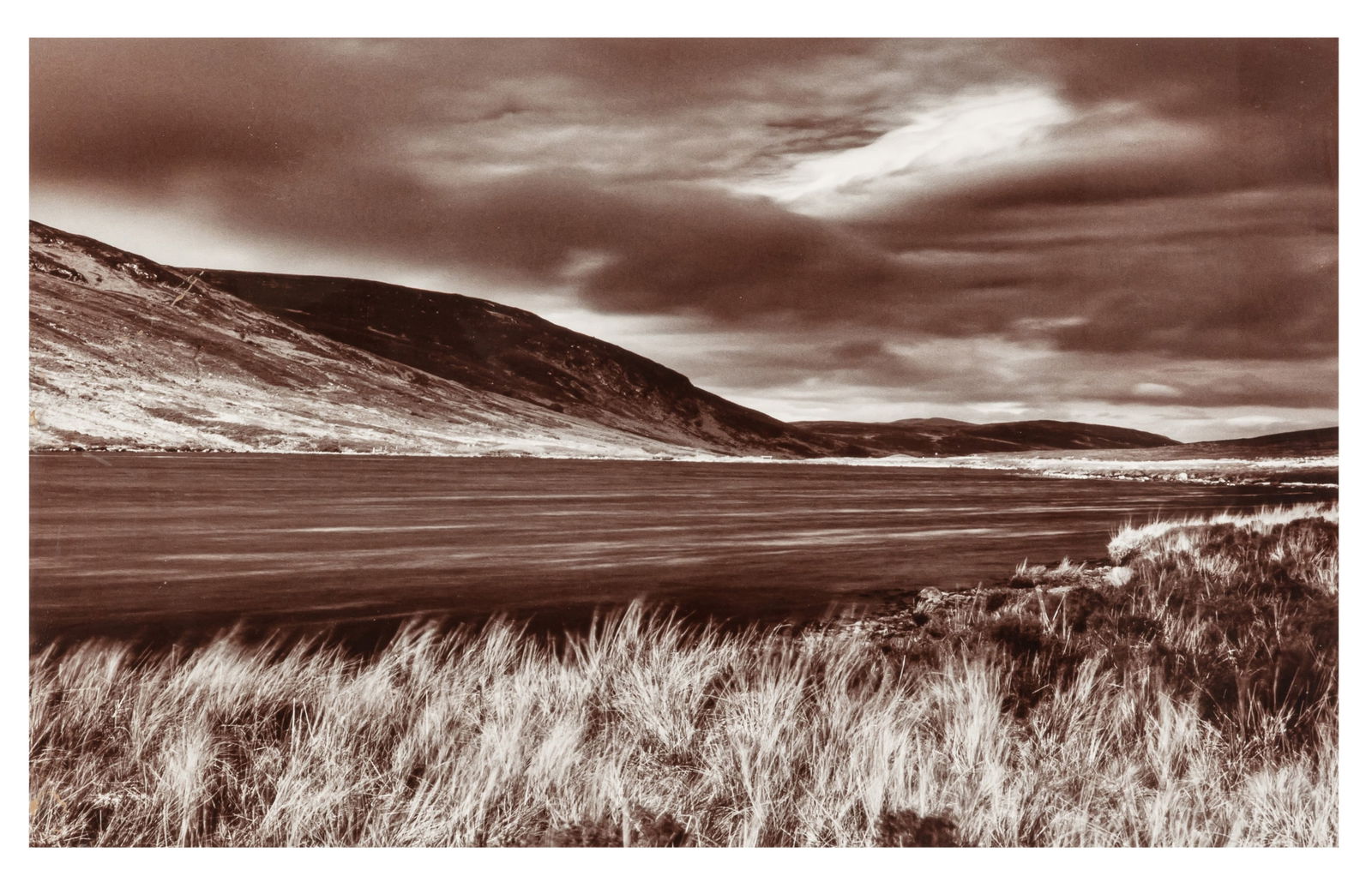Brenda MacNeill (XX) Loch Landscape: Brenda MacNeill (XX) Loch Landscape A framed toned silver print, image size 27 x 44cm, signed and titled by the photographer on the overmount. Framed, frame size 54 x 63cm. Together with a framed