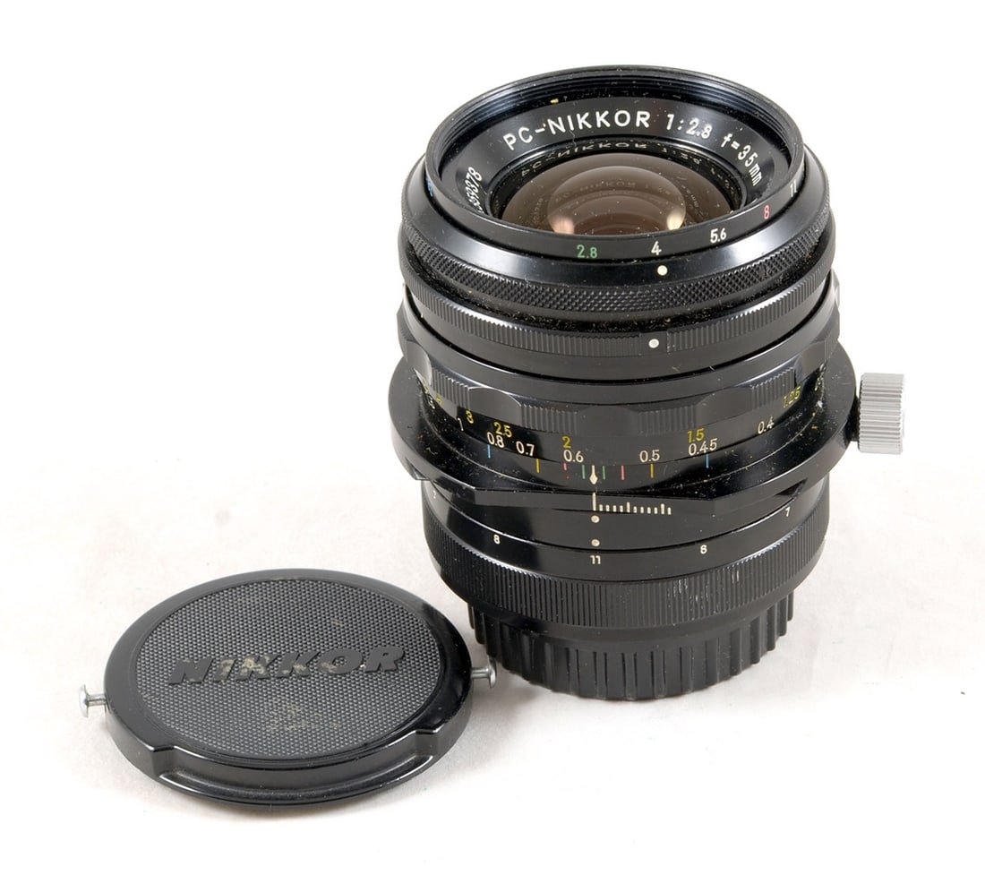 Early 35mm f2.8 PC-Nikkor Perspective Control Lens. With early caps. (1 of 2)