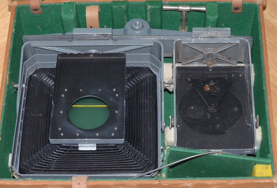 Ex-WD Air Ministry RAF Whole Plate Monorail Camera.: Ex-WD Air Ministry RAF Whole Plate Monorail Camera. Basic design with an unusual integral shutter with "TIME" and "INSTANT" settings, fired by cable release. In a fitted carry case.