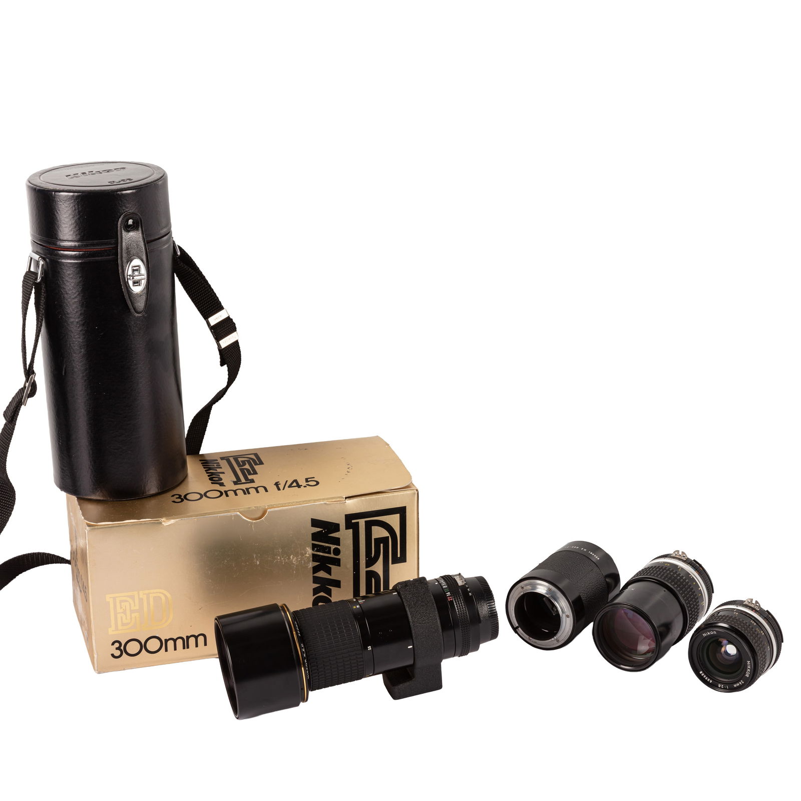 Nikon Four Lenses Including Two Boxed Lenses Examples: Nikon Four Lenses Including Two Boxed Lenses Examples Nikon 24mm f/2.8 Nikkor Lens Serial No: 639683 Body: VG Optics: VG Notes: with maker's caps, HN-1 lens hood, L1Bc filter, maker's lens bag,