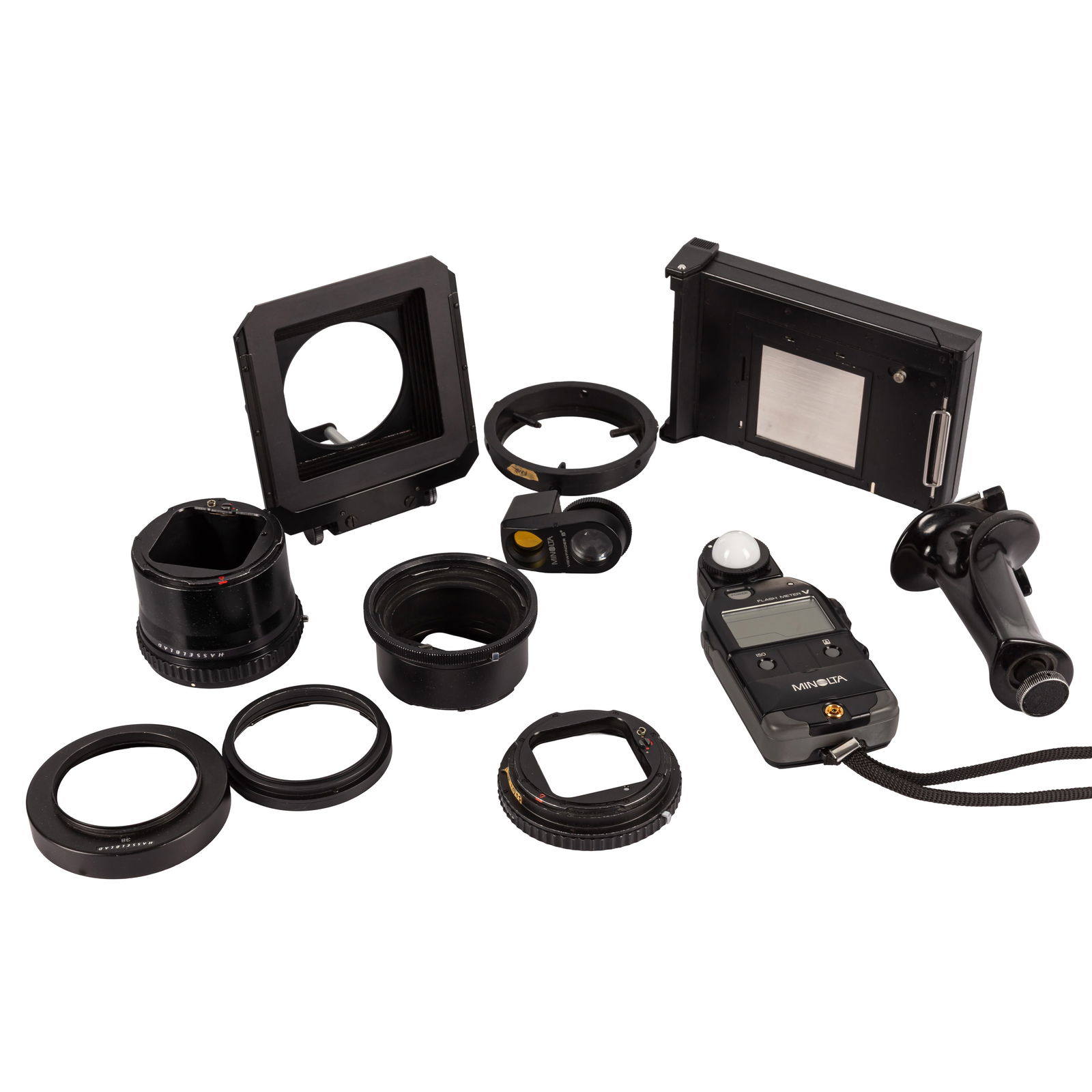 A Selection of Hasselblad Accessories and a Minolta Flash Meter V with Viewfinder II: A Selection of Hasselblad Accessories and a Minolta Flash Meter V with Viewfinder II including a Hasselblad Polaroid back, trigger grip in maker's box, various extension tubes, rapid winding crank,