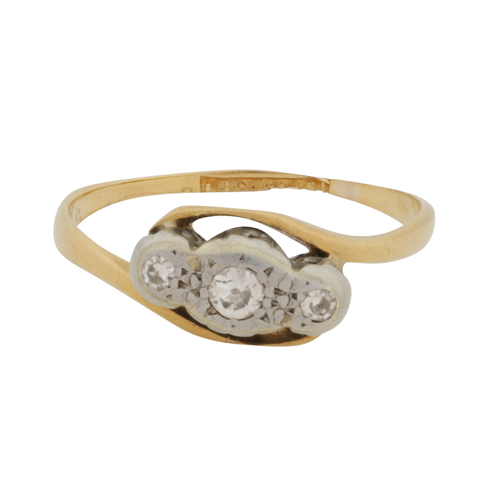 A diamond three stone ring Yellow and white metal: A diamond three stone ring Yellow and white metal Set with an old brilliant-cut diamond and two single-cut diamonds, within wavy shoulders, to a bi-colour metal mount, indistinct mark, ring size